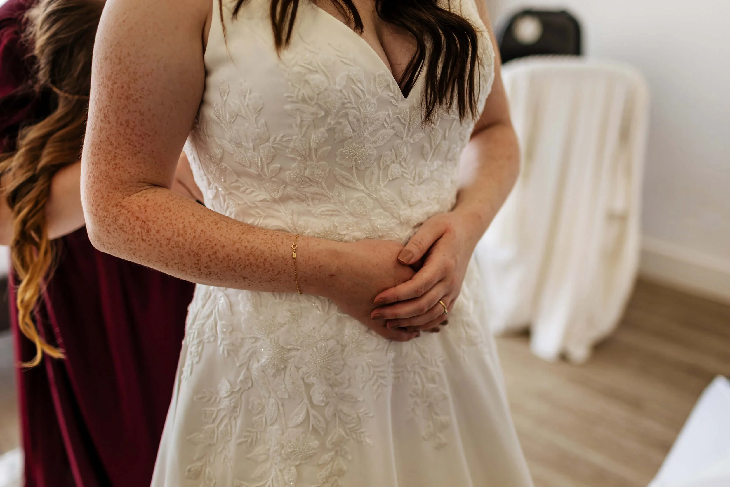 Close up of the bride's hands in her wedding dress in Yorkshire
