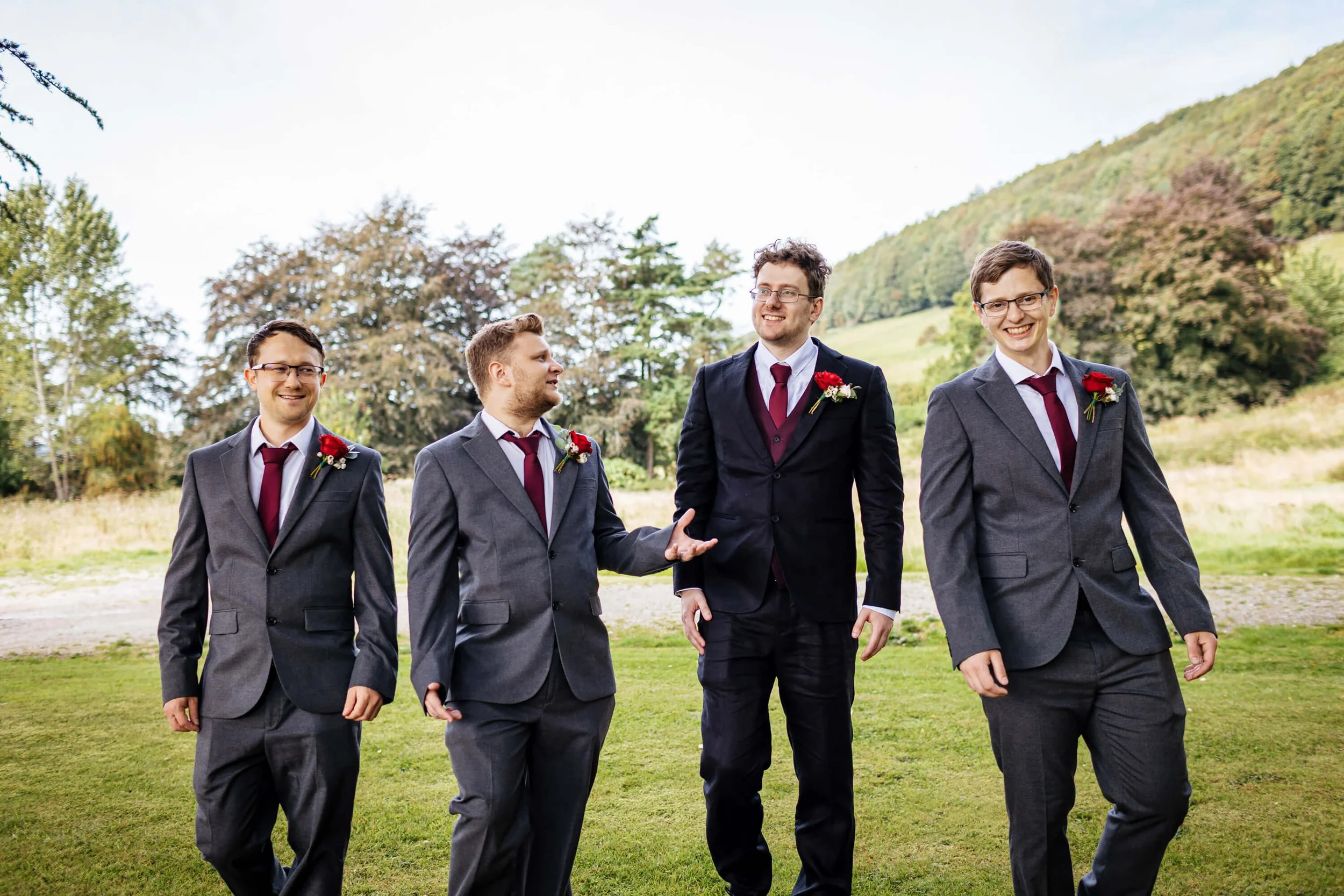 Groomsmen laughing with the groom on his wedding morning