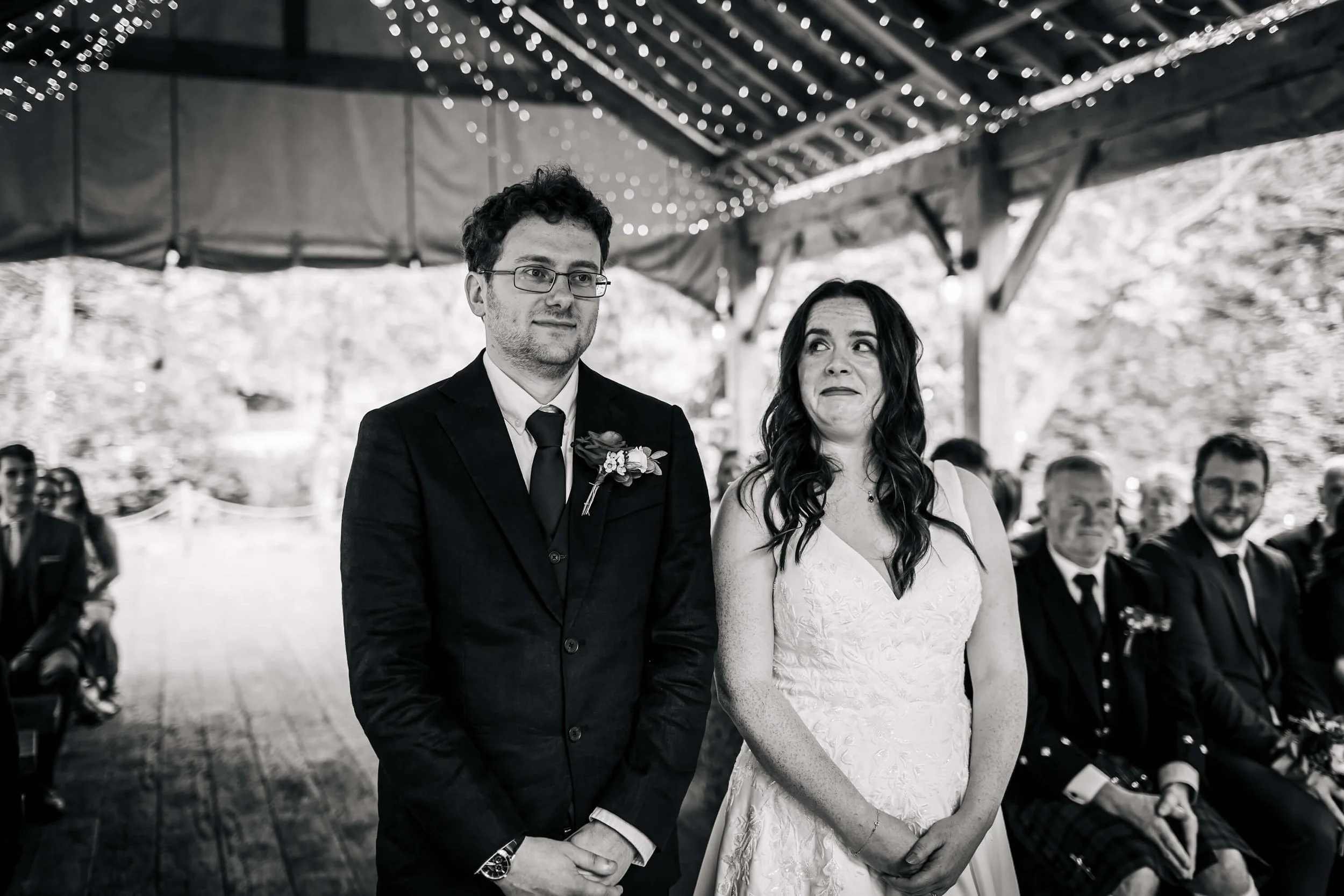 Bride looking at the groom in a funny way during the wedding