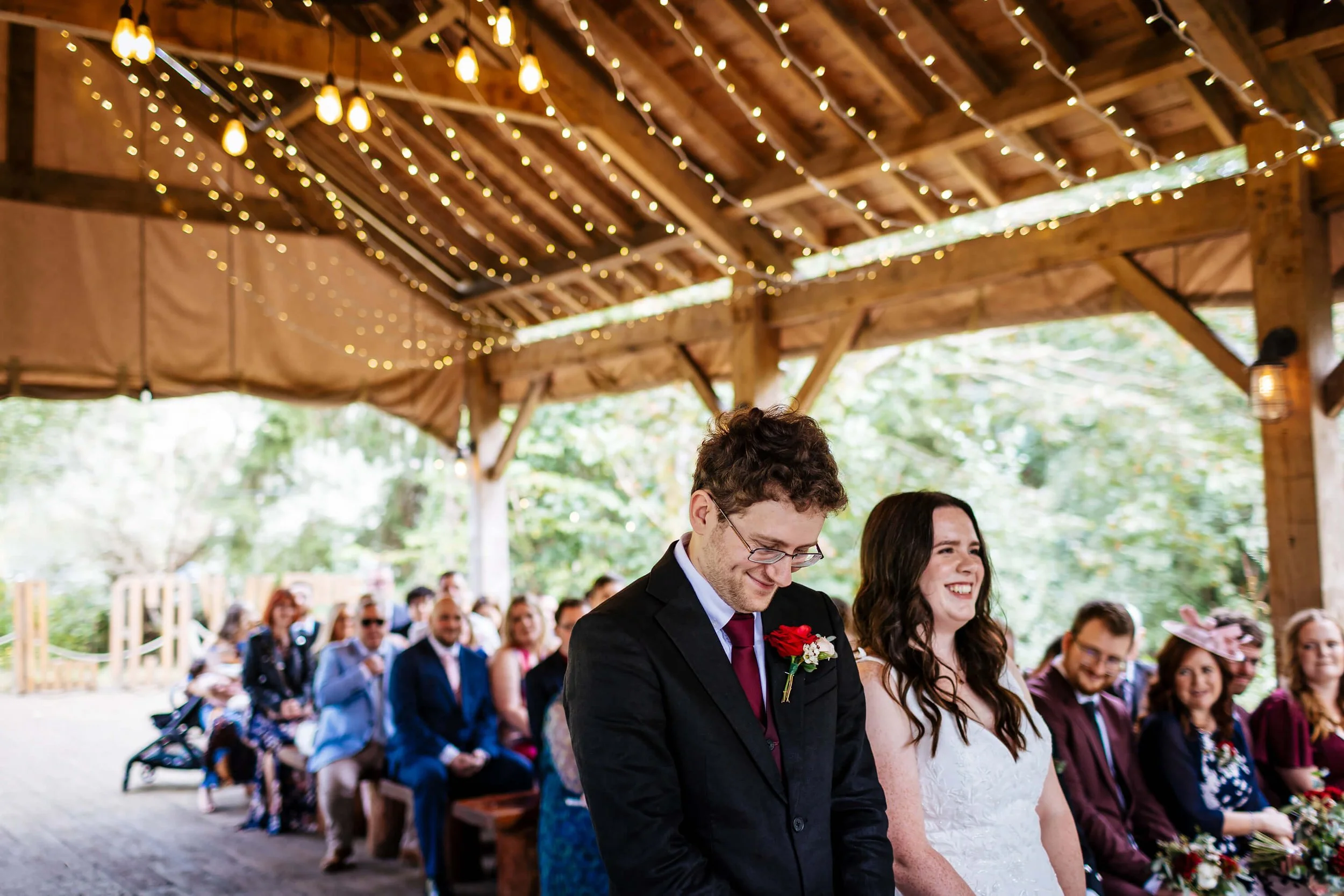 Bride and groom laughing during their wedding ceremony