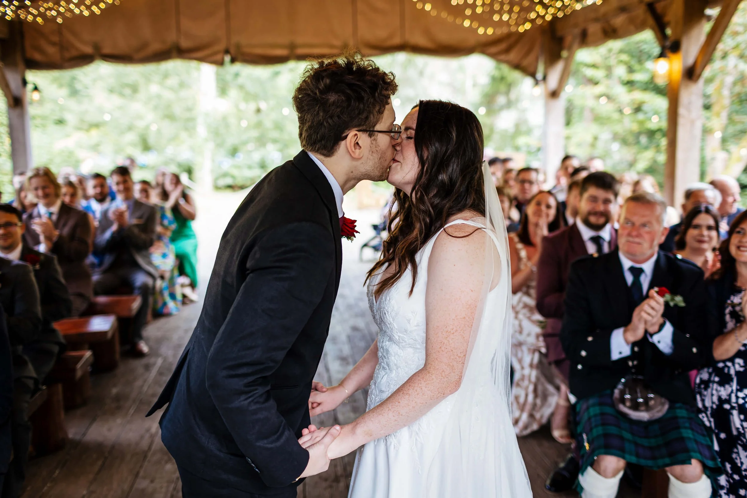 Couple have their first kiss as man and wife at their wedding