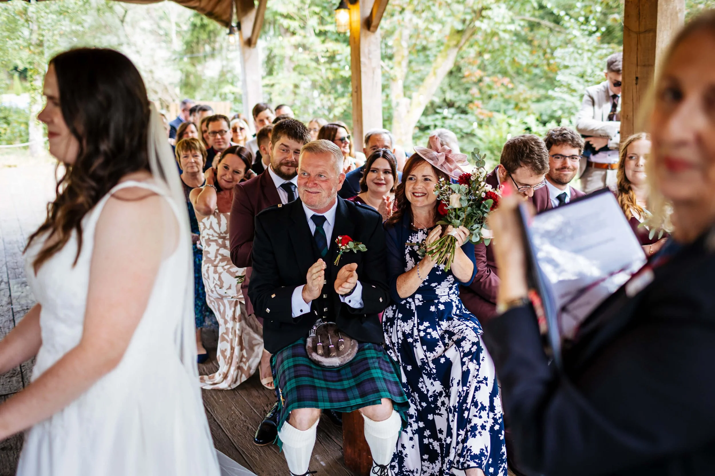 Wedding guests clapping at the ceremony at Hackness Grange