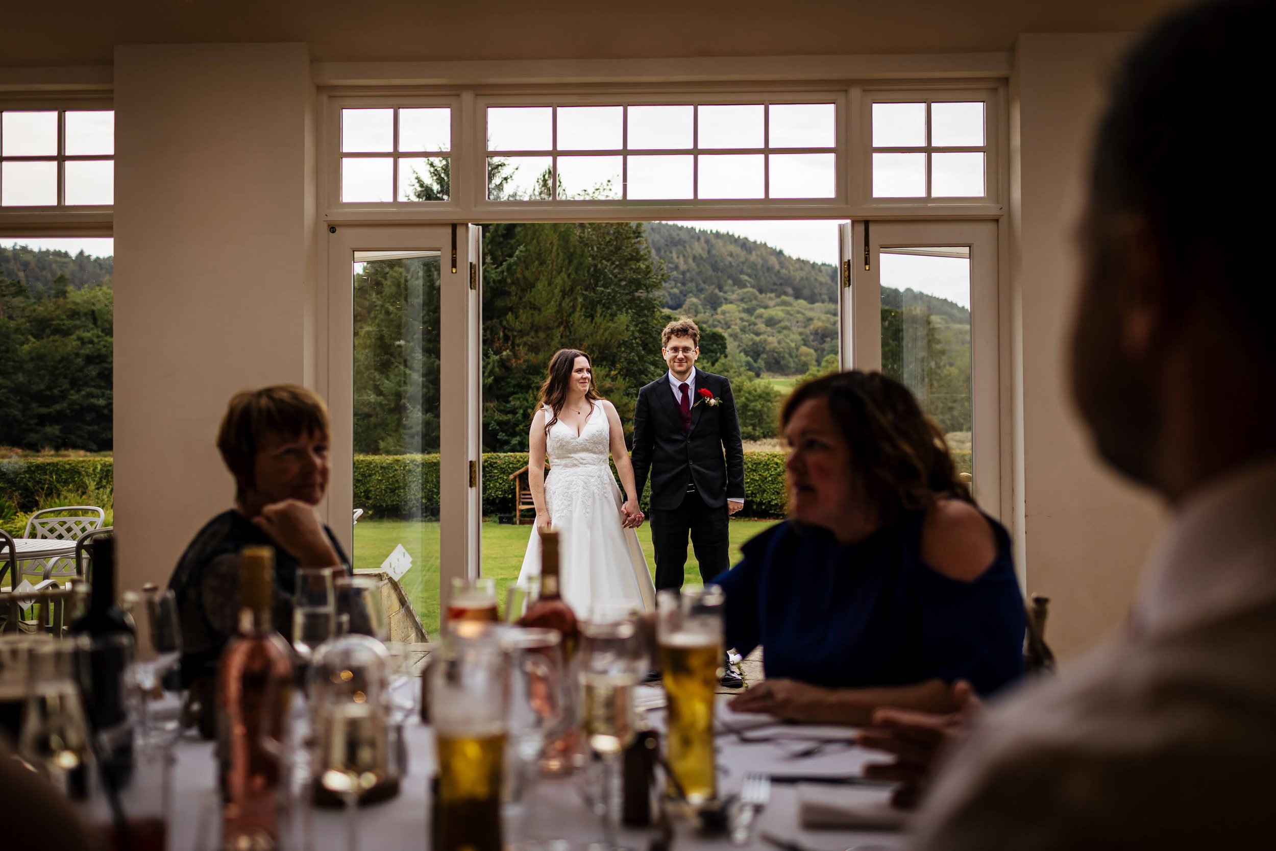 Bride and groom ready to enter the wedding breakfast room