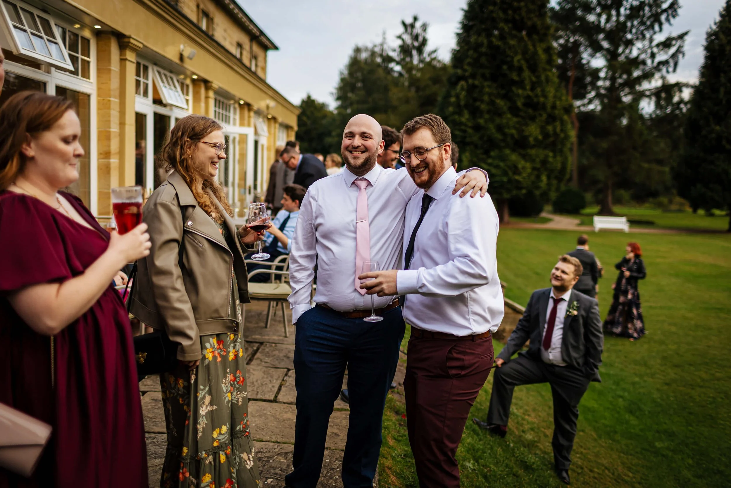 Guests enjoying drinks at the wedding reception