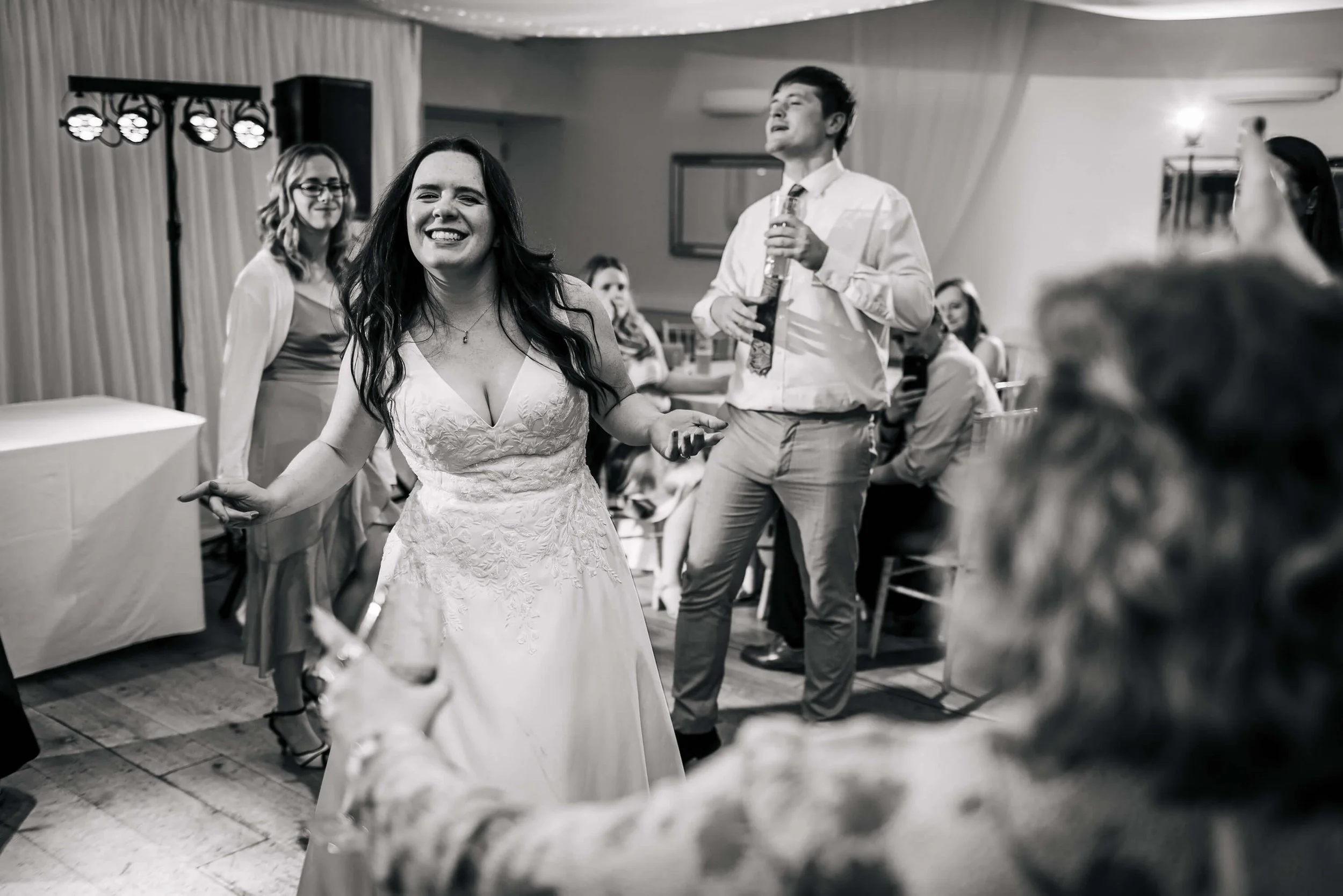 Bride dancing and having fun on the dance floor at Hackness Grange