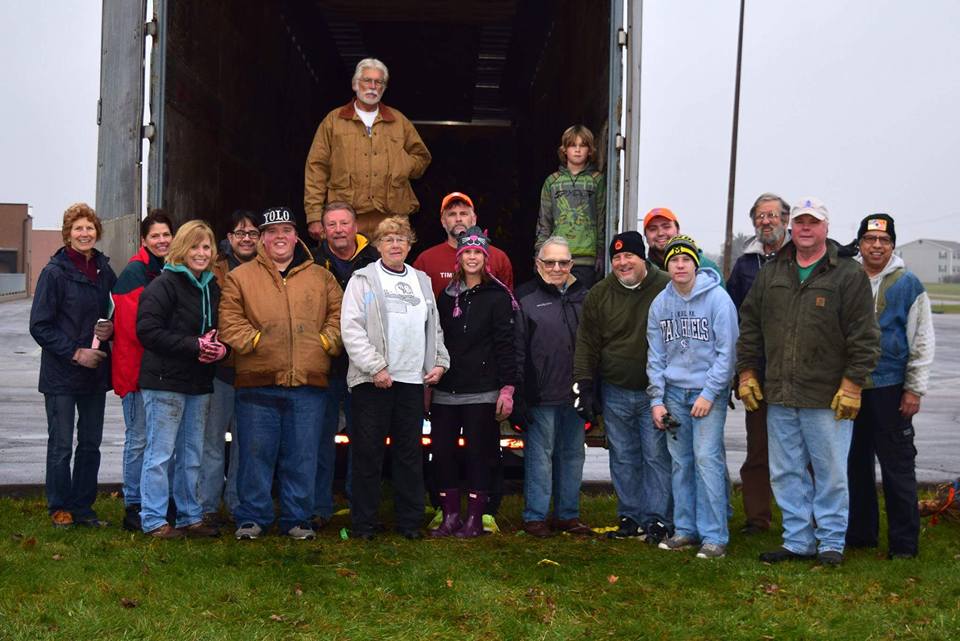 Local Civitans unloading Christmas trees at the Civitan Tree Lot, where all proceeds are donated.