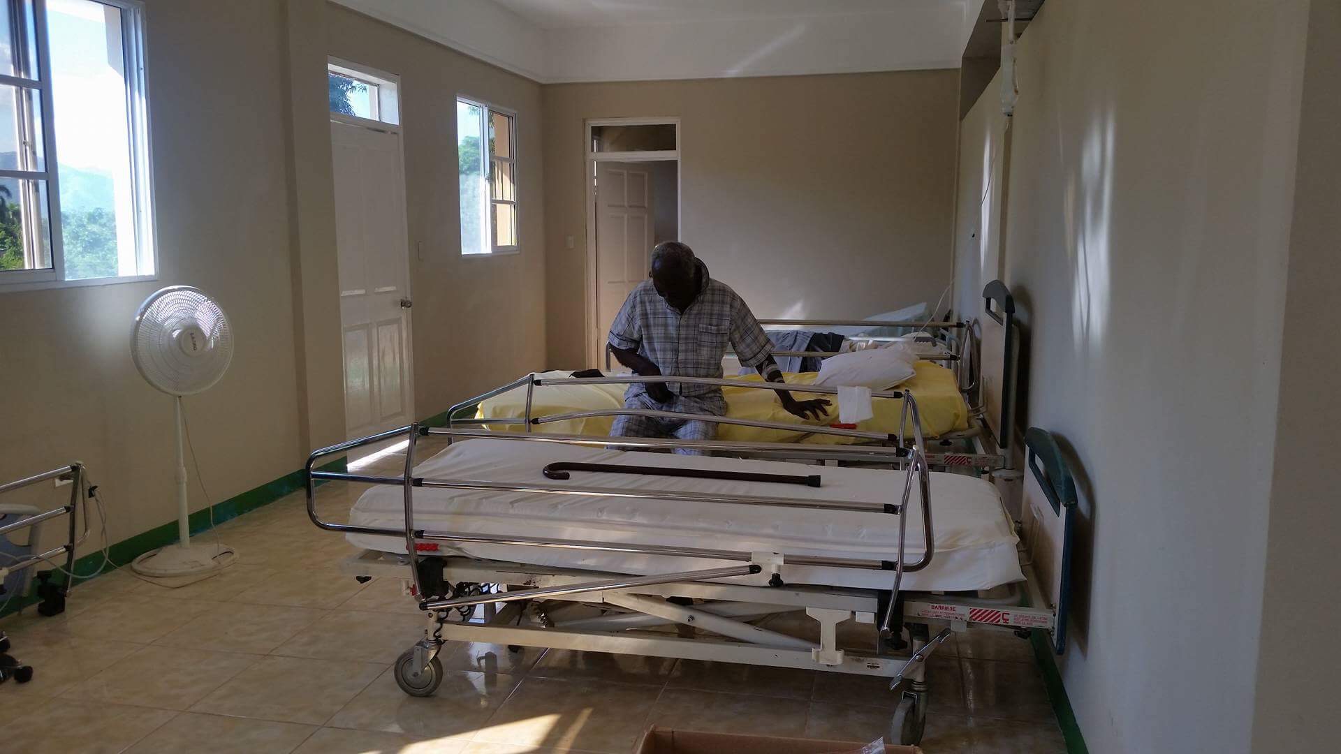  A patient sits on a hospital bed in the newly opened CHIDA Hospital in Cap Haitien, Haiti 