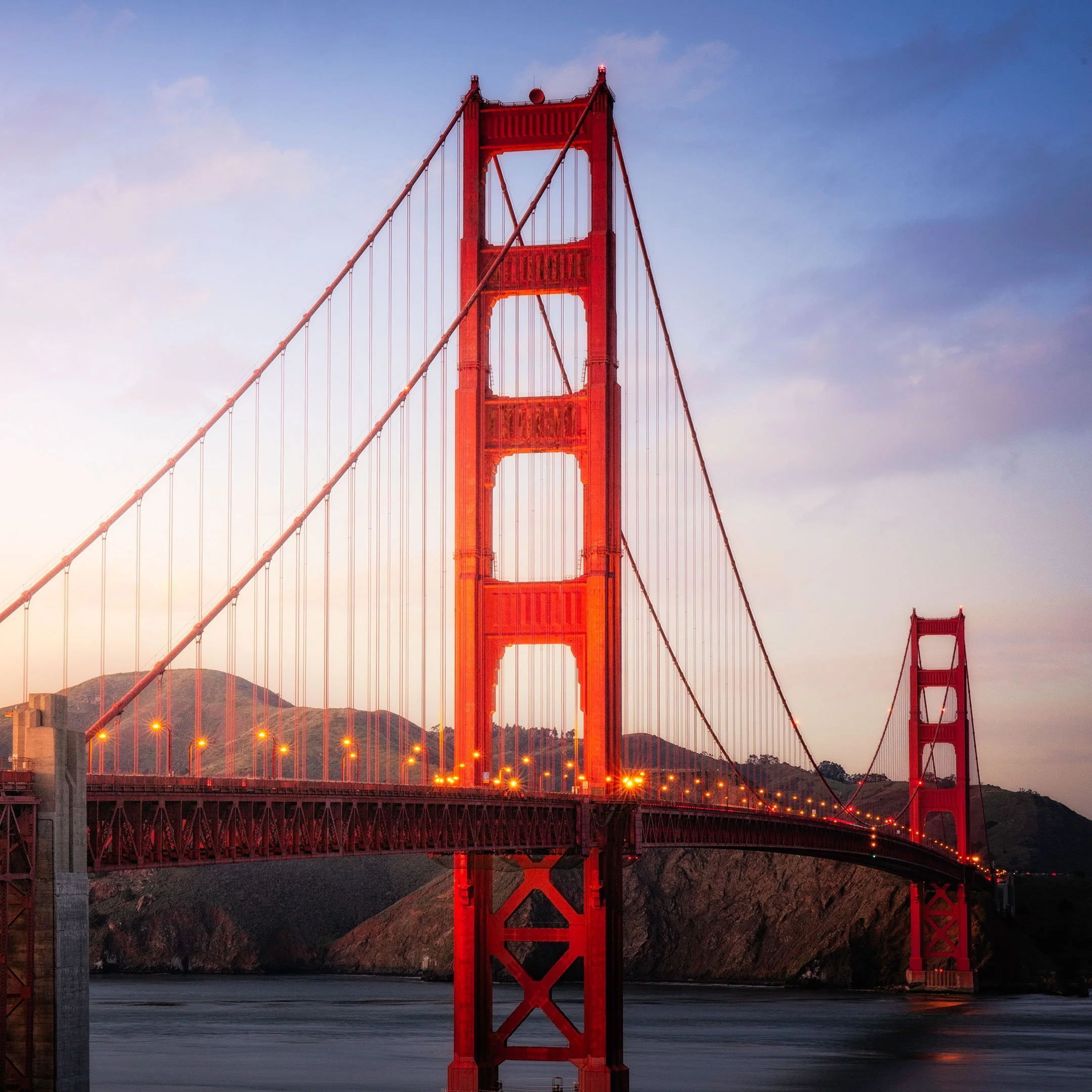 The Golden Gate Bridge lit up at dusk in San Francisco, California, by Ryan L. Smith