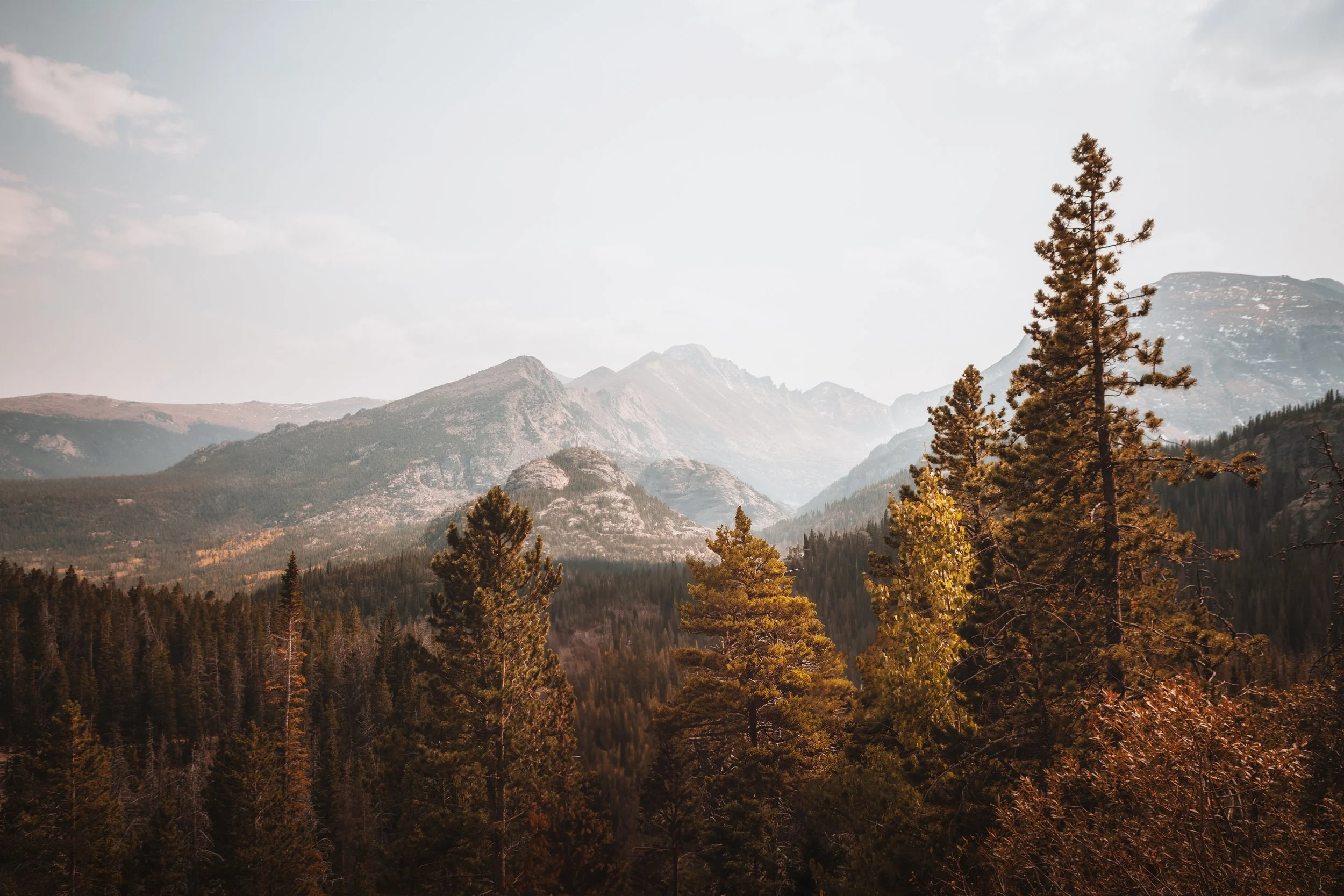 Peaks rising above the still surface of Dream Lake in Rocky Mountain National Park, Colorado, by Ryan L. Smith