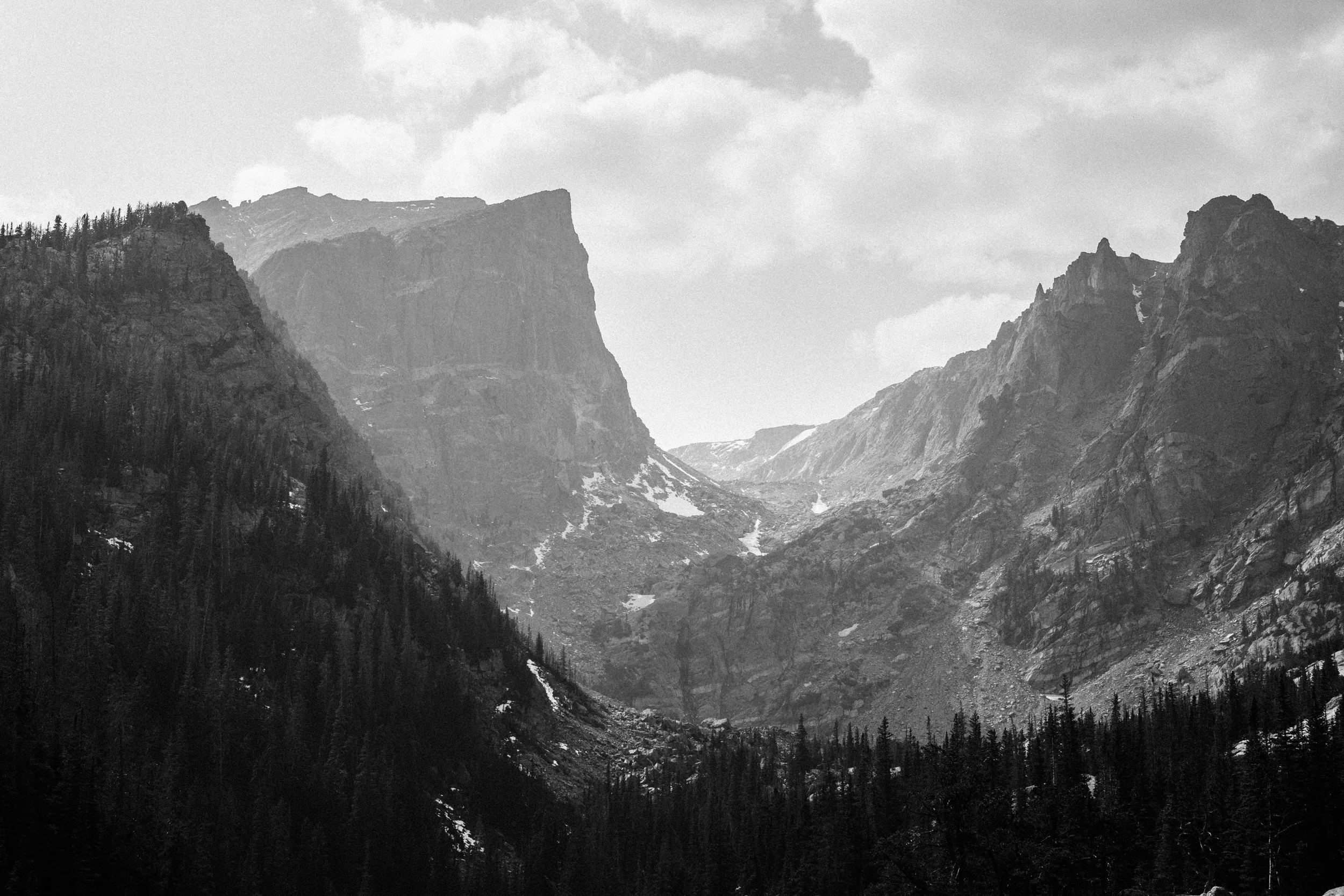 A black and white view of the mountain gap above Dream Lake, Rocky Mountain National Park, Colorado, by Ryan L. Smith