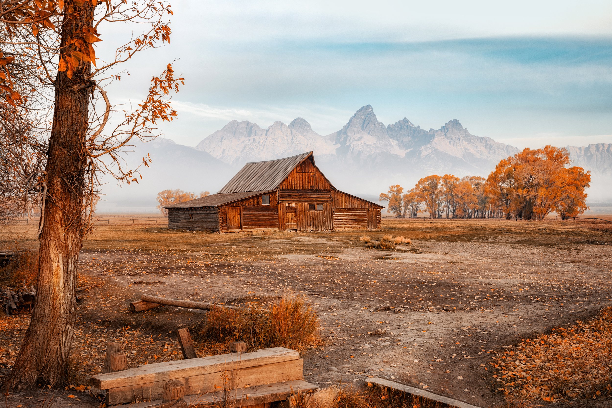 Sunrise on the Teton Range behind the historic barns of Mormon Row, Grand Teton National Park, Wyoming, by Ryan L. Smith