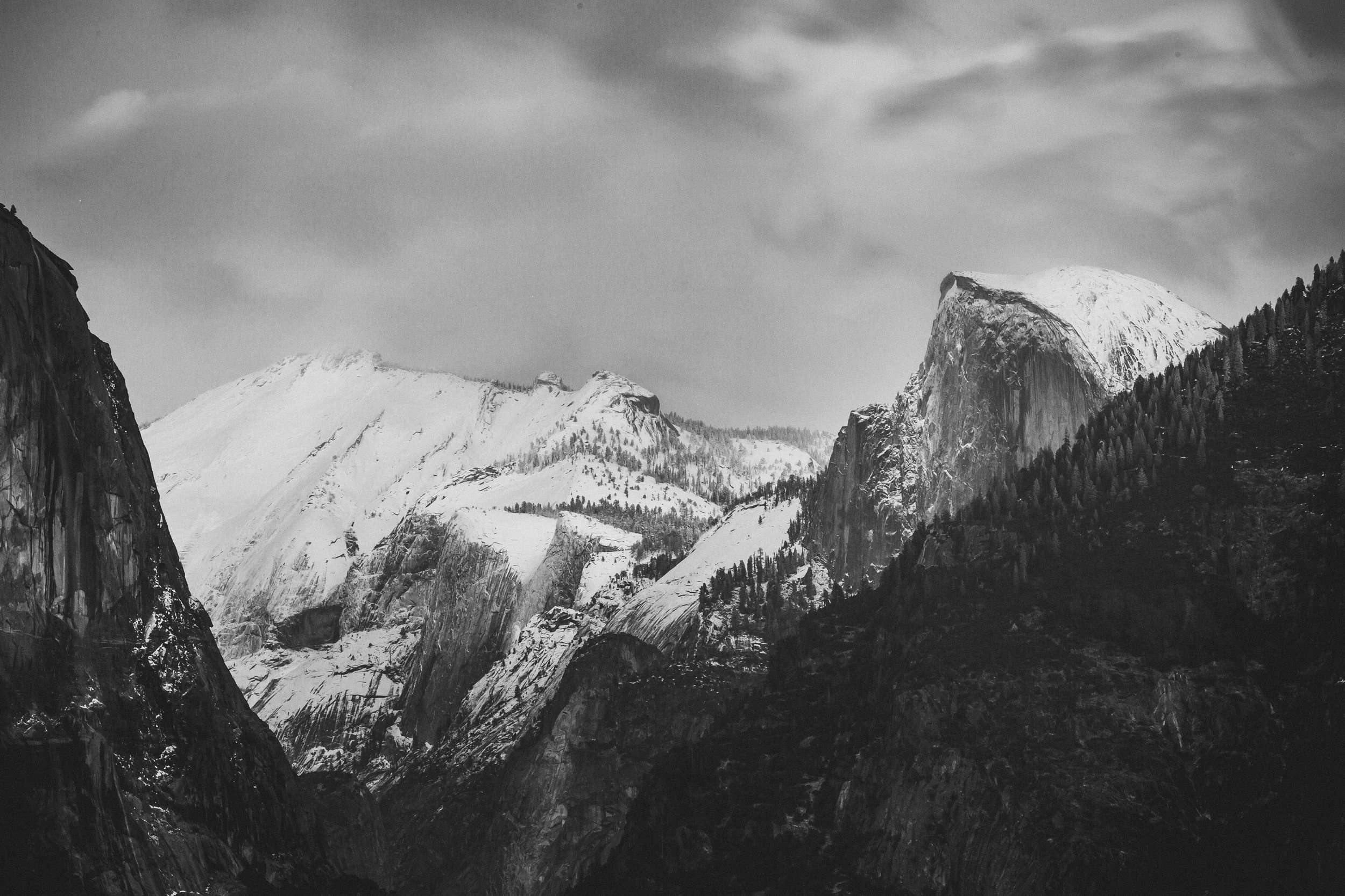 A tight black and white view of snow-dusted Half Dome from Tunnel View, Yosemite National Park, California, by Ryan L. Smith
