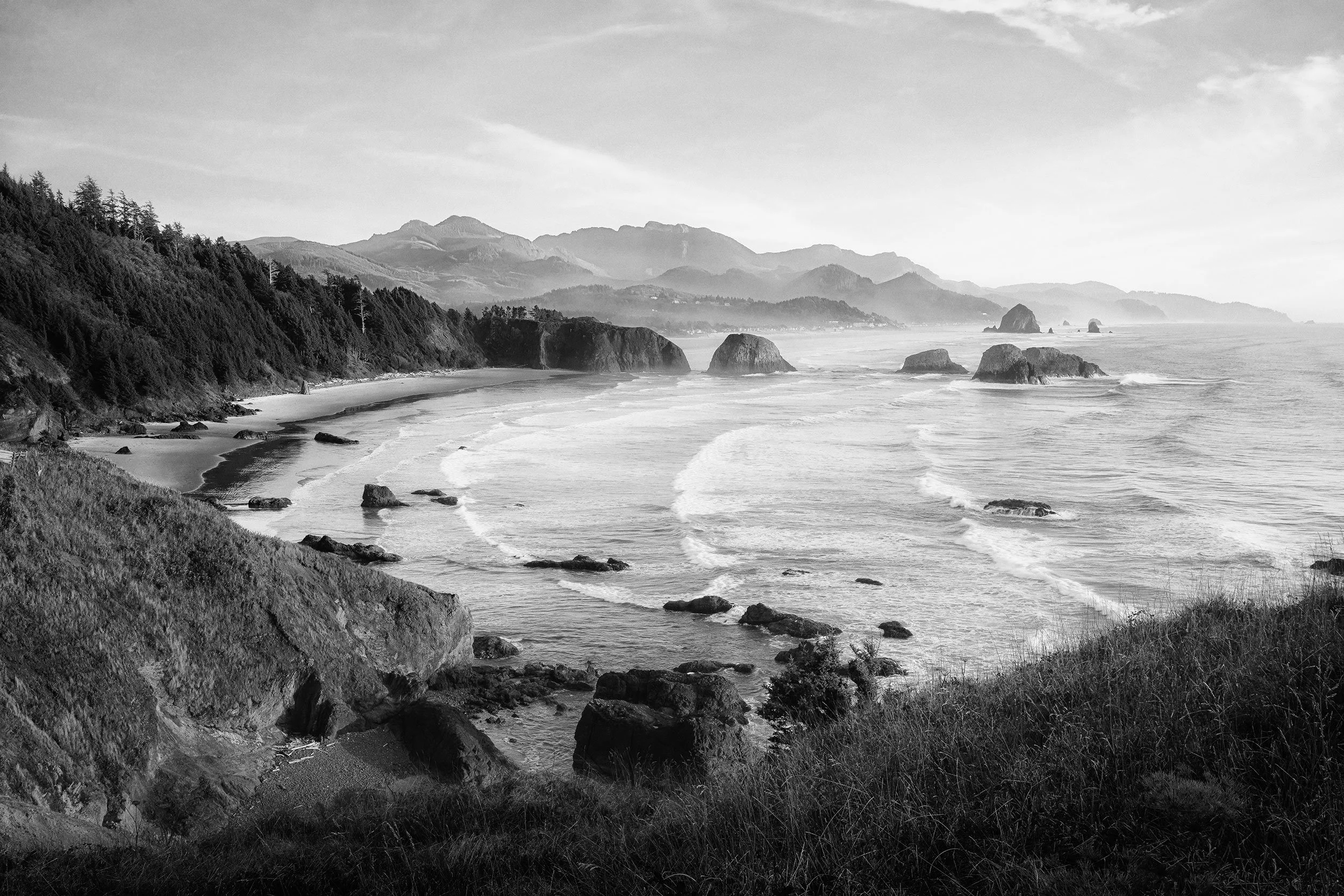 Black and white photograph of the headlands and sea stacks at Ecola State Park, Oregon coast, by Ryan L. Smith