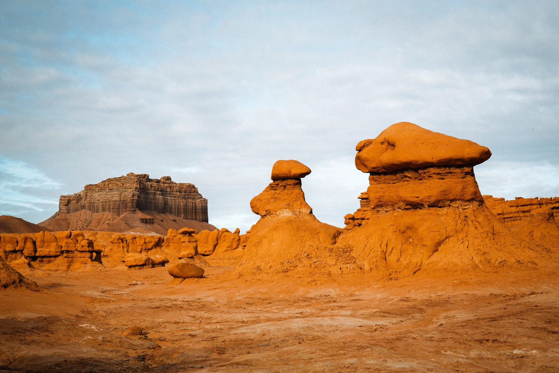 Eroded sandstone hoodoo formations in Goblin Valley State Park, Utah, by Ryan L. Smith