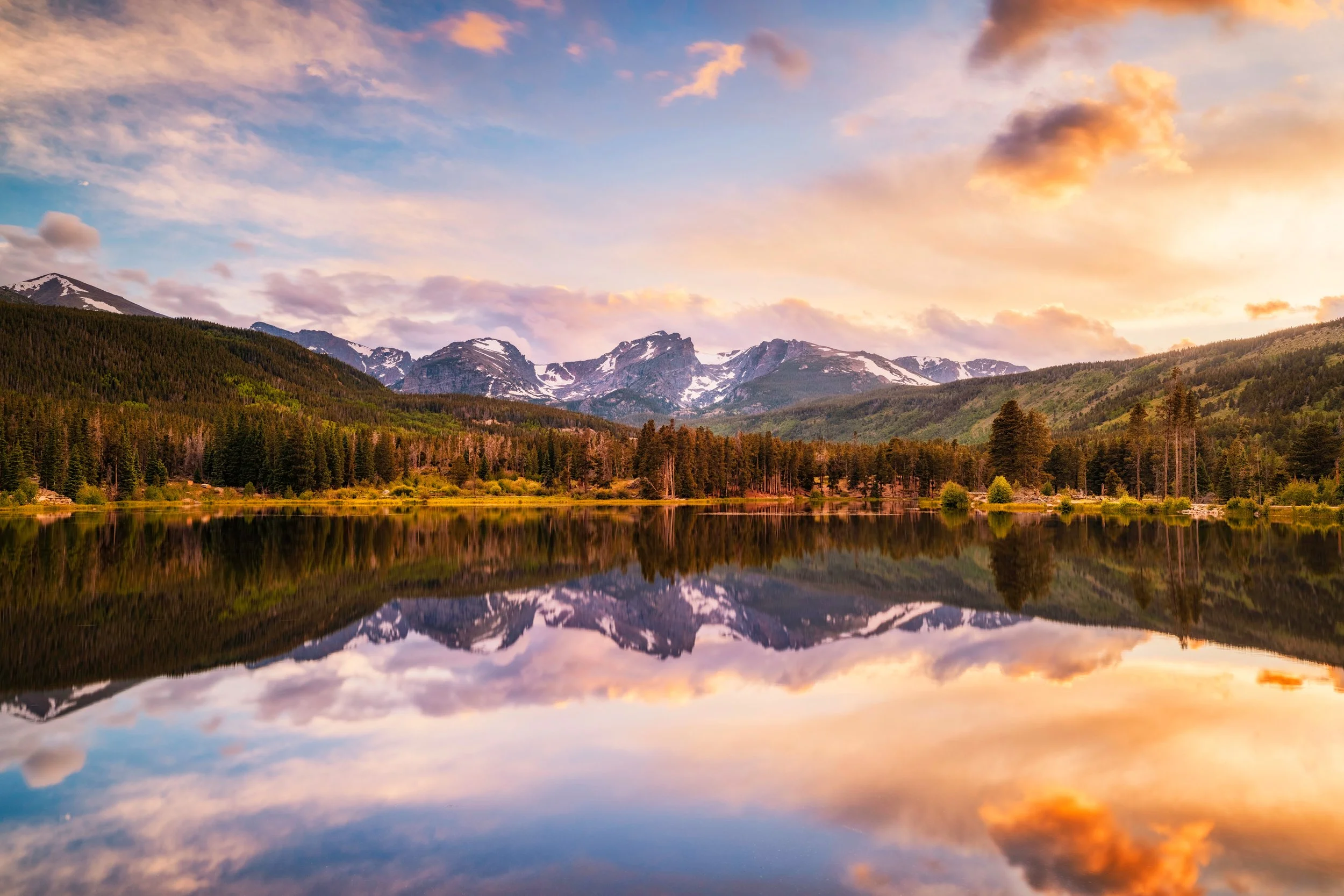Sunset radiance over the peaks reflected in Sprague Lake, Rocky Mountain National Park, Colorado, by Ryan L. Smith