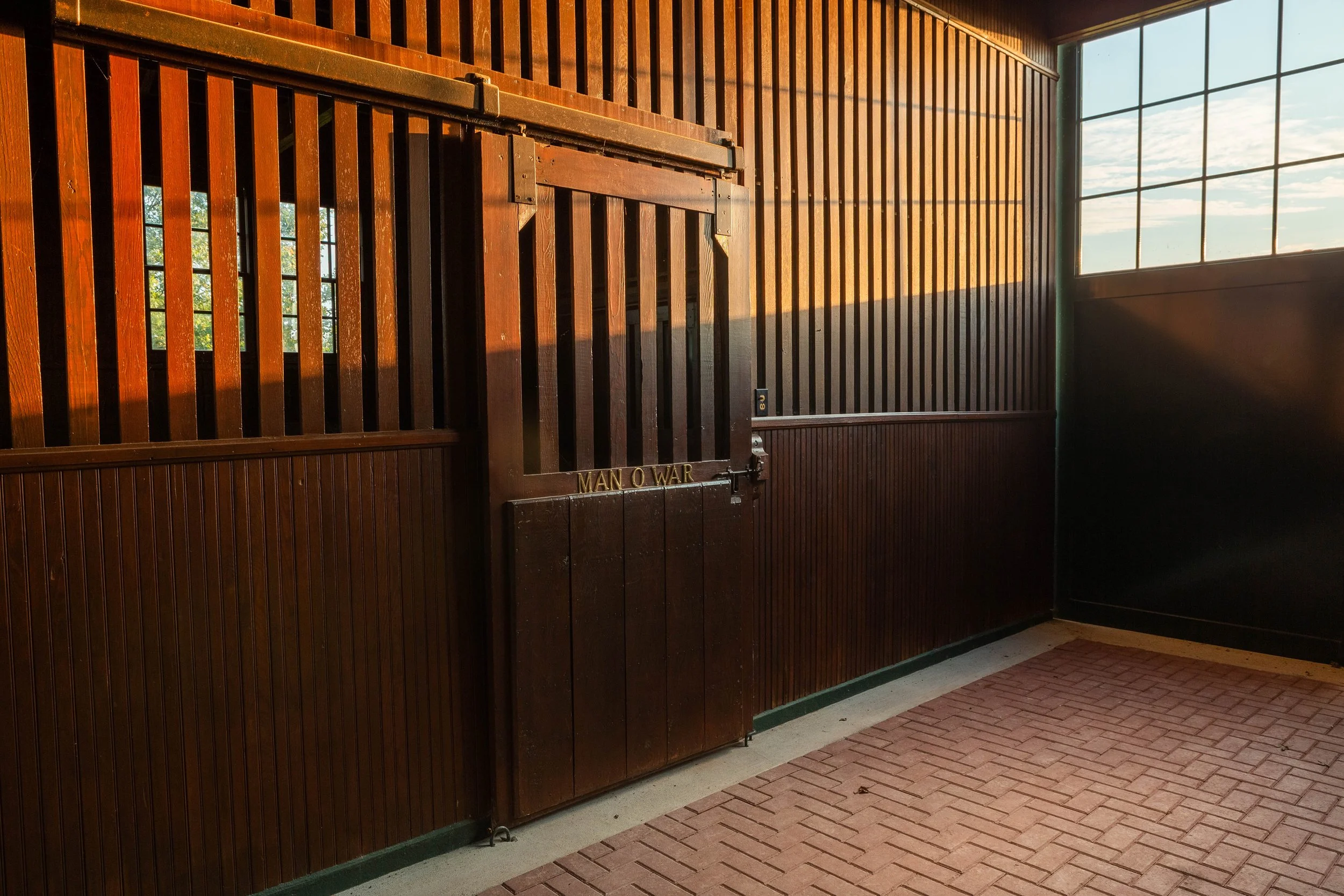 Man o' War stall door and nameplate inside the historic barn at Mt. Brilliant Farm