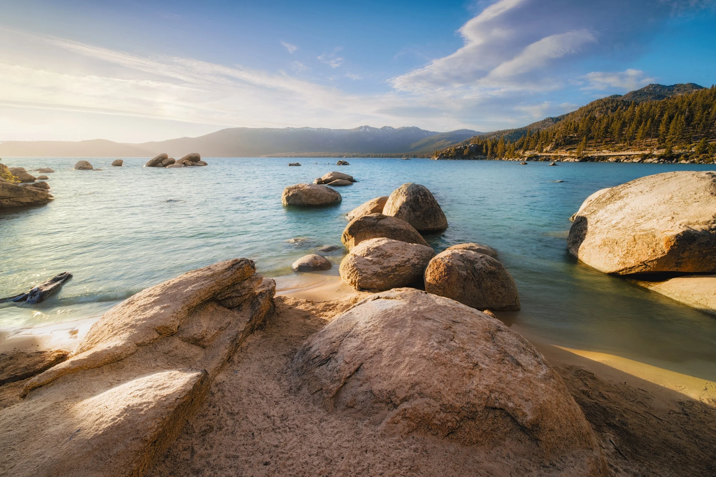 Sunset over the clear water and boulders of Sand Harbor, Lake Tahoe, Nevada, by Ryan L. Smith
