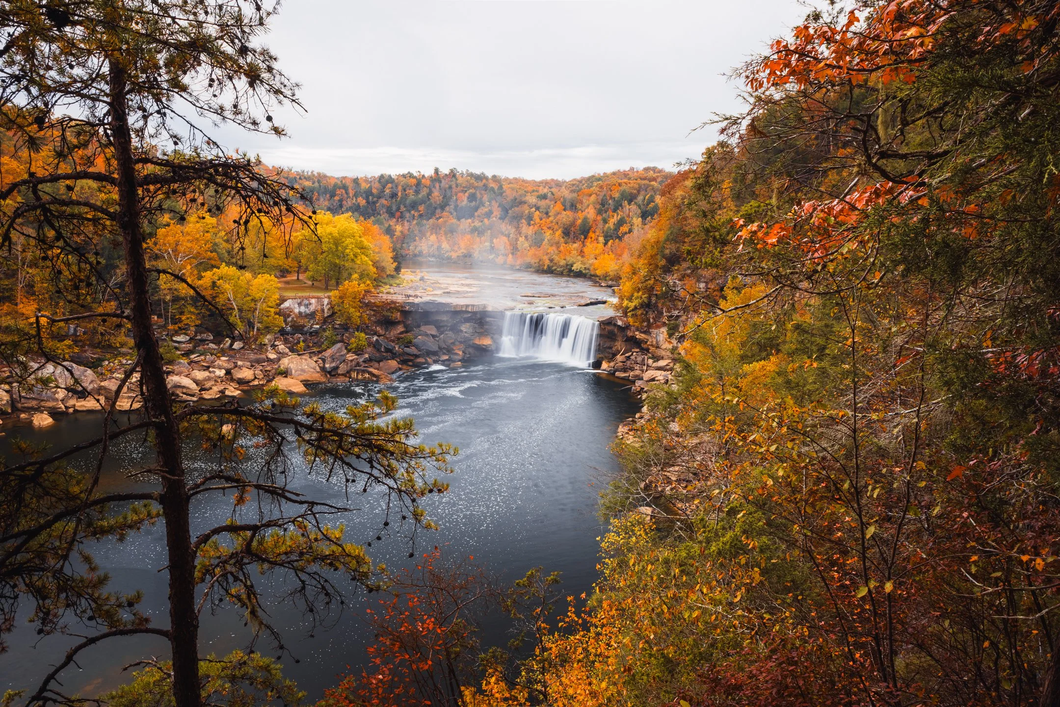 Autumn color framing Cumberland Falls seen from the Eagle Falls overlook, Kentucky, by Ryan L. Smith