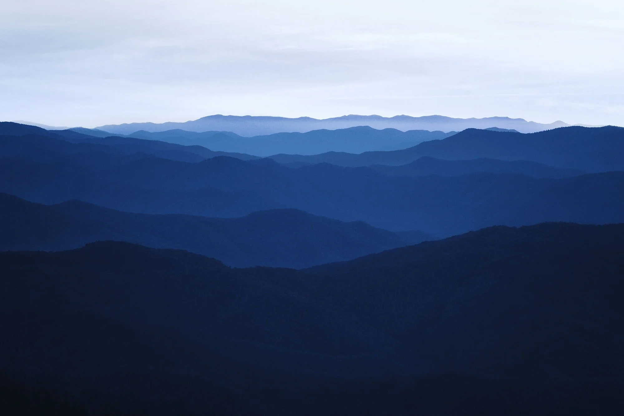 Layered blue ridgelines fading into haze at dusk, Blue Ridge Mountains, by Ryan L. Smith