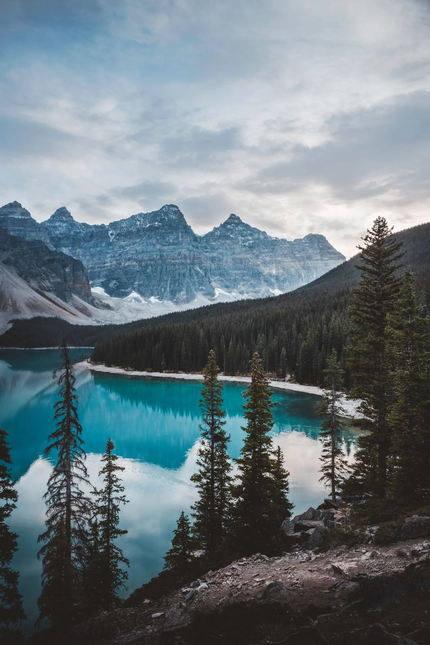 Moody clouds over the turquoise water and peaks of Moraine Lake, Banff National Park, Alberta, by Ryan L. Smith