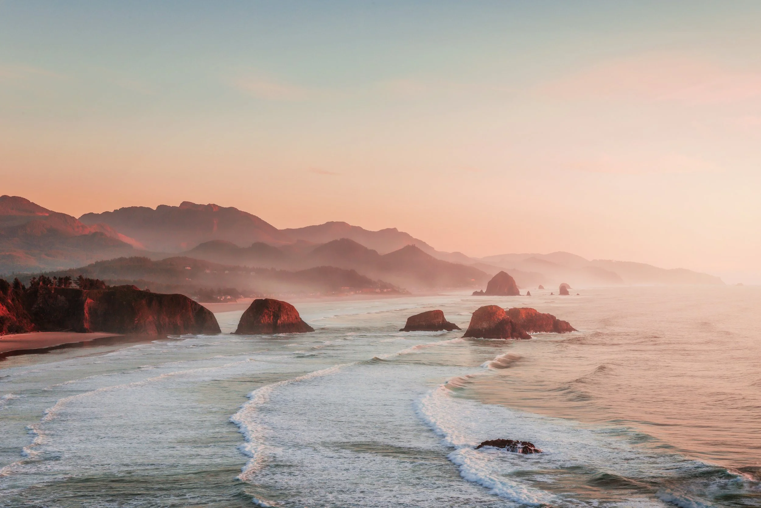 Golden sunset light over the rugged coastline at Ecola State Park near Cannon Beach, Oregon, by Ryan L. Smith