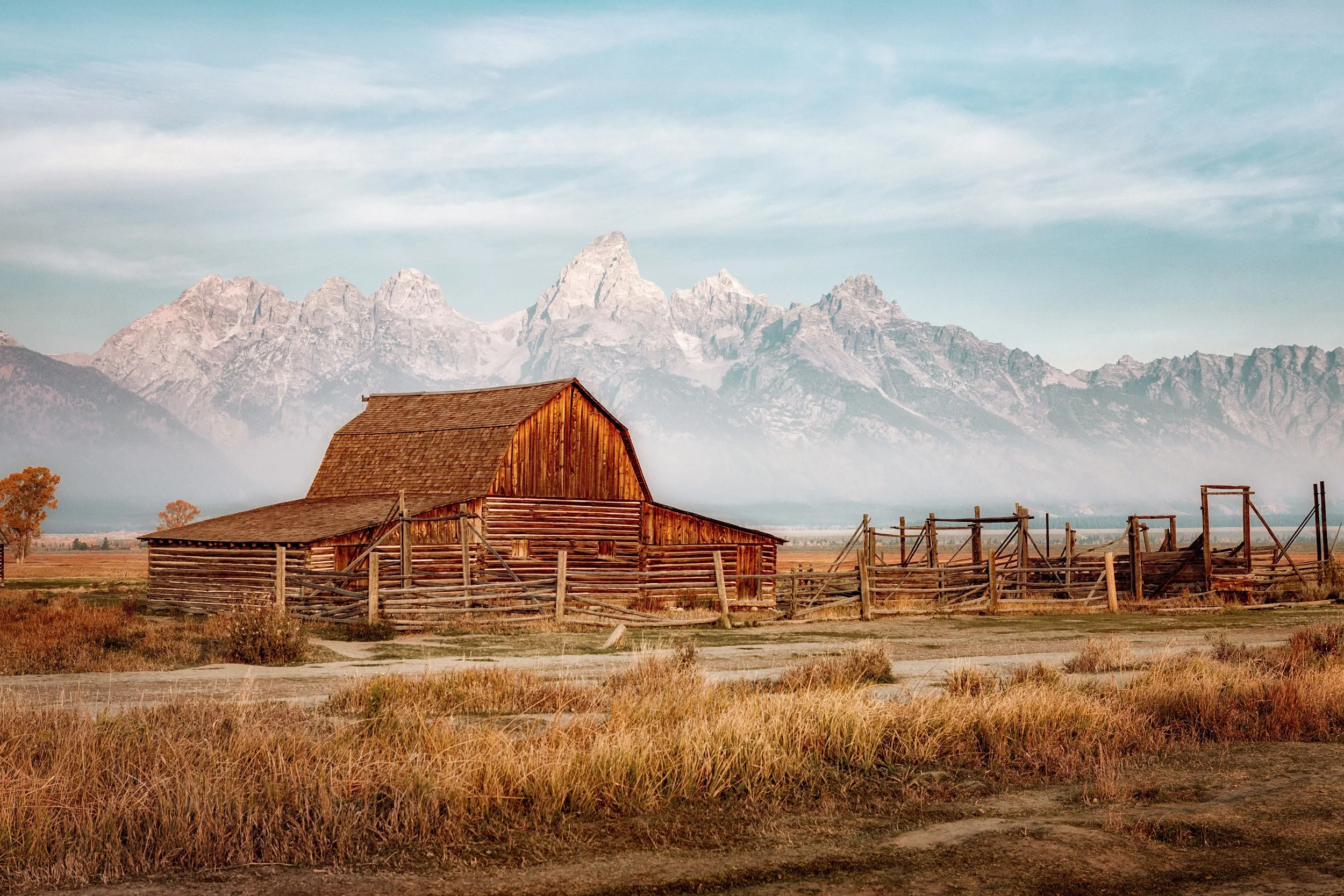 Sunrise light on the T.A. Moulton Barn with the Teton Range behind, Mormon Row, Grand Teton National Park, Wyoming, by Ryan L. Smith