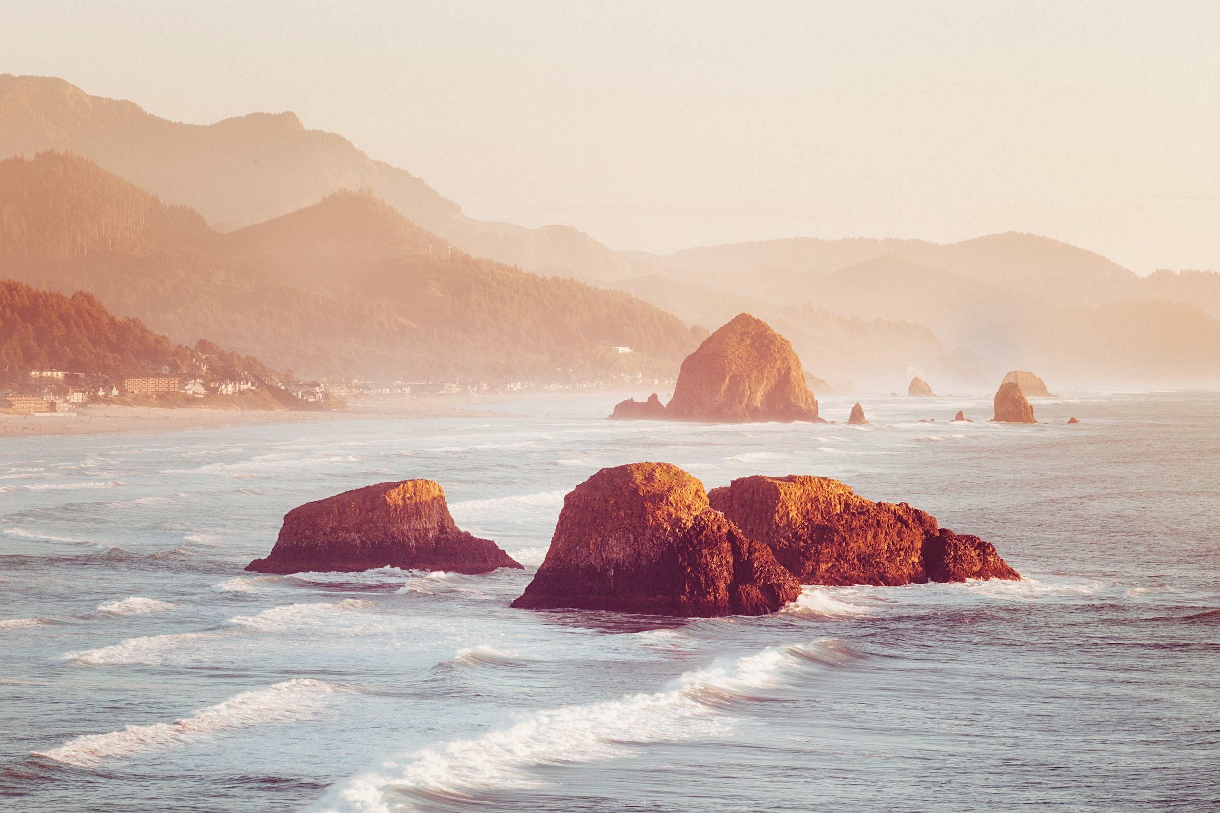 Sunset glow behind Haystack Rock at Cannon Beach, Oregon, by Ryan L. Smith