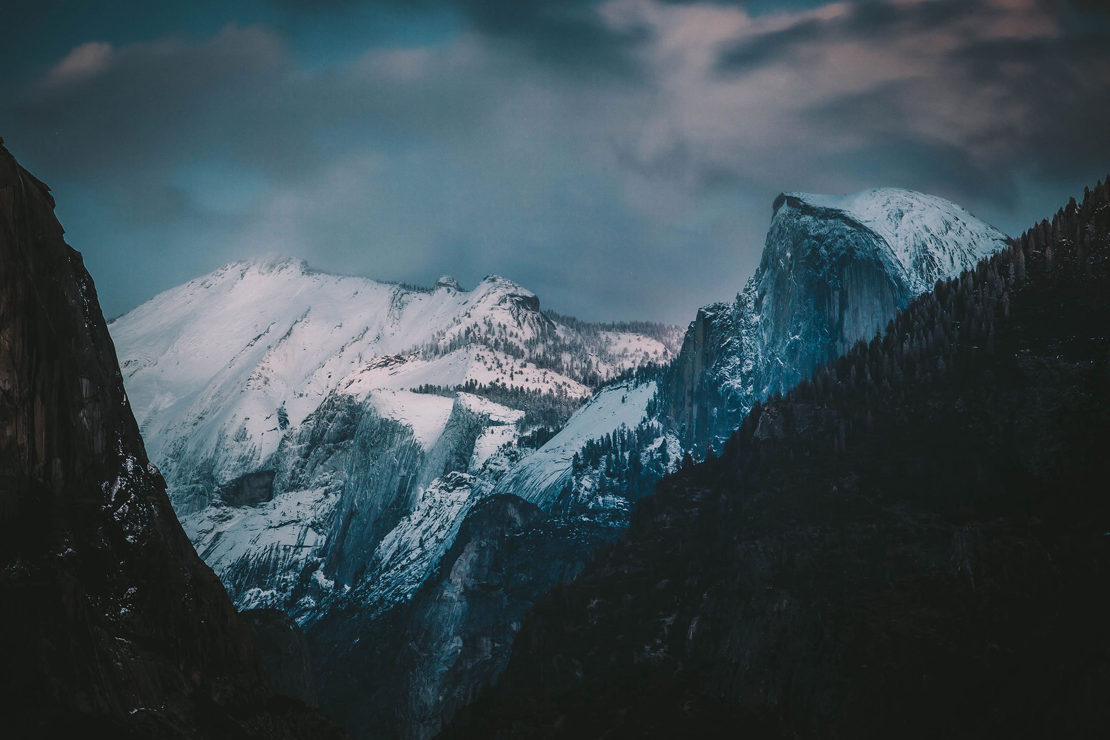 Snow covered granite peaks including Half Dome in Yosemite Valley, California, by Ryan L. Smith
