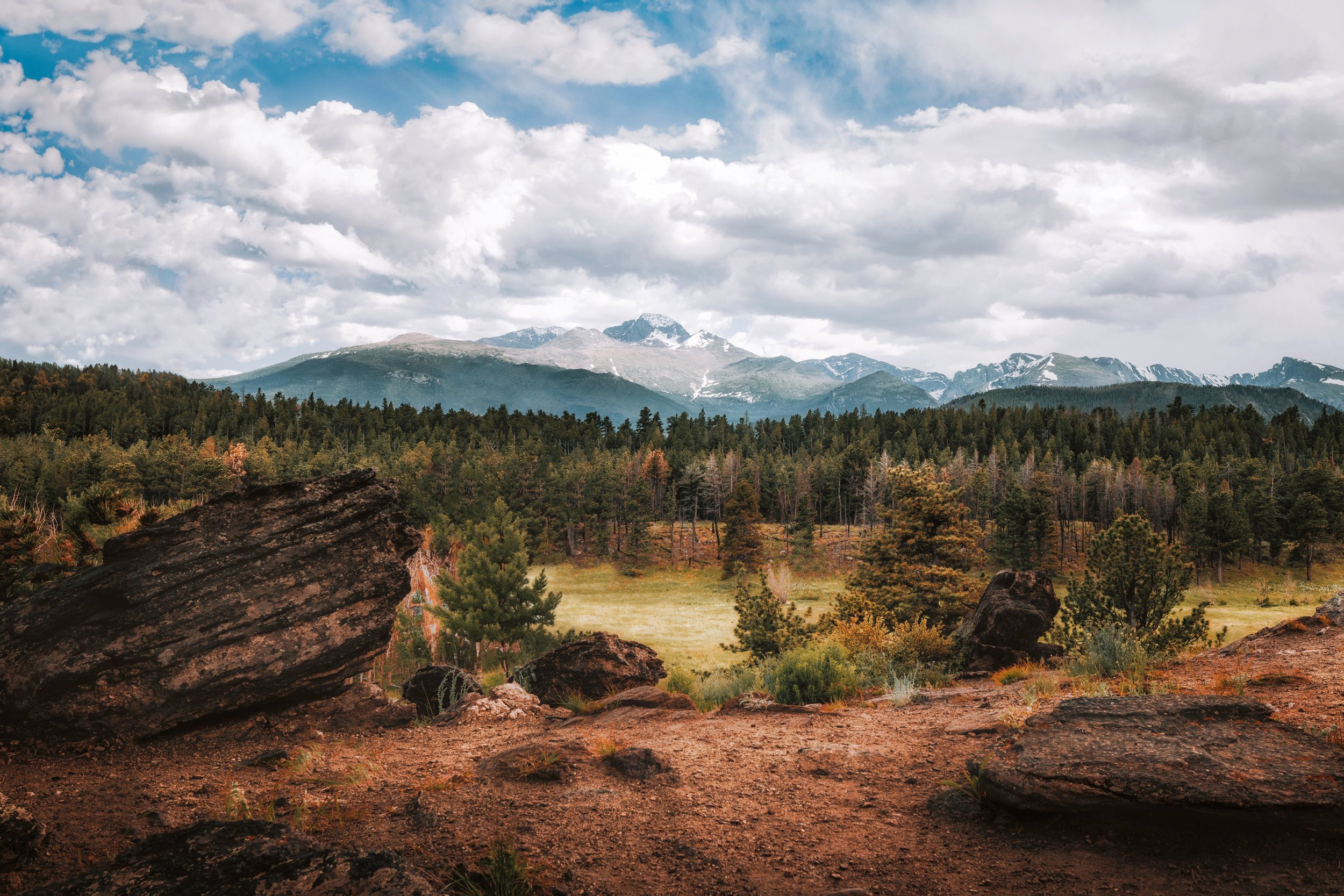 Summer light over the green meadows and distant peaks of Beaver Meadows, Rocky Mountain National Park, Colorado, by Ryan L. Smith