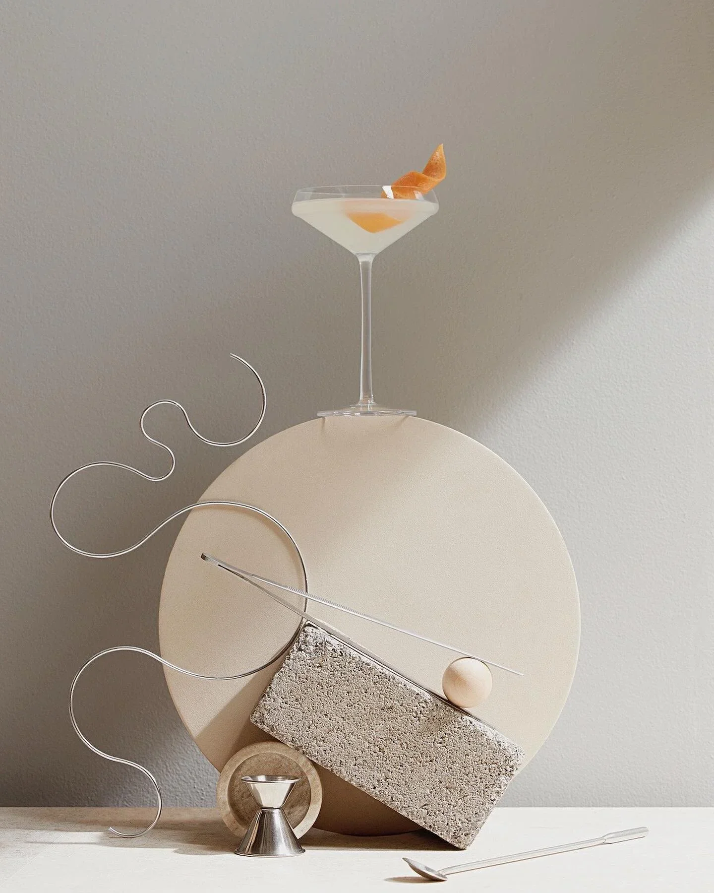 Balanced martini glass cocktail photography