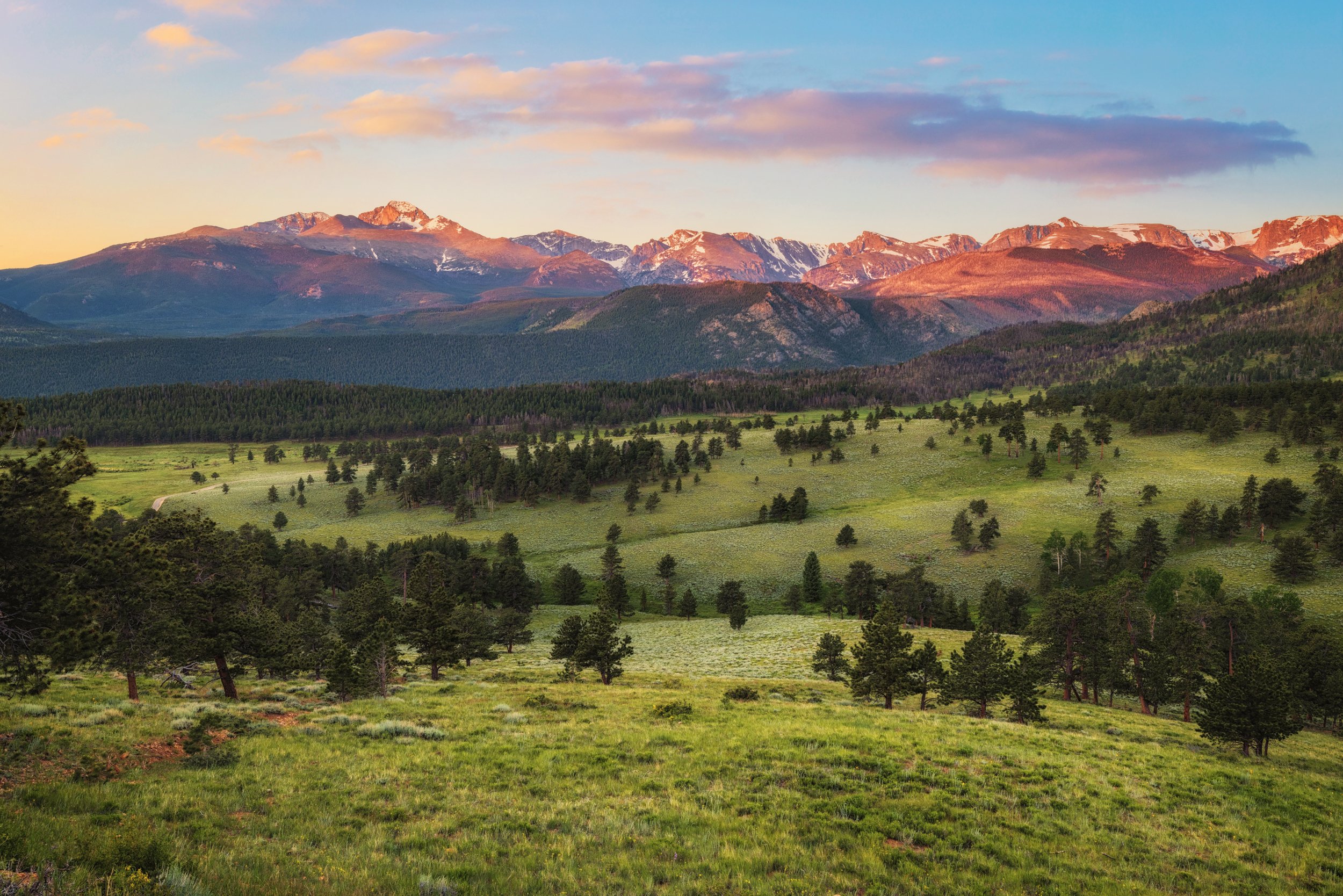 Sunrise warming the peaks above Beaver Meadows, Rocky Mountain National Park, Colorado, by Ryan L. Smith