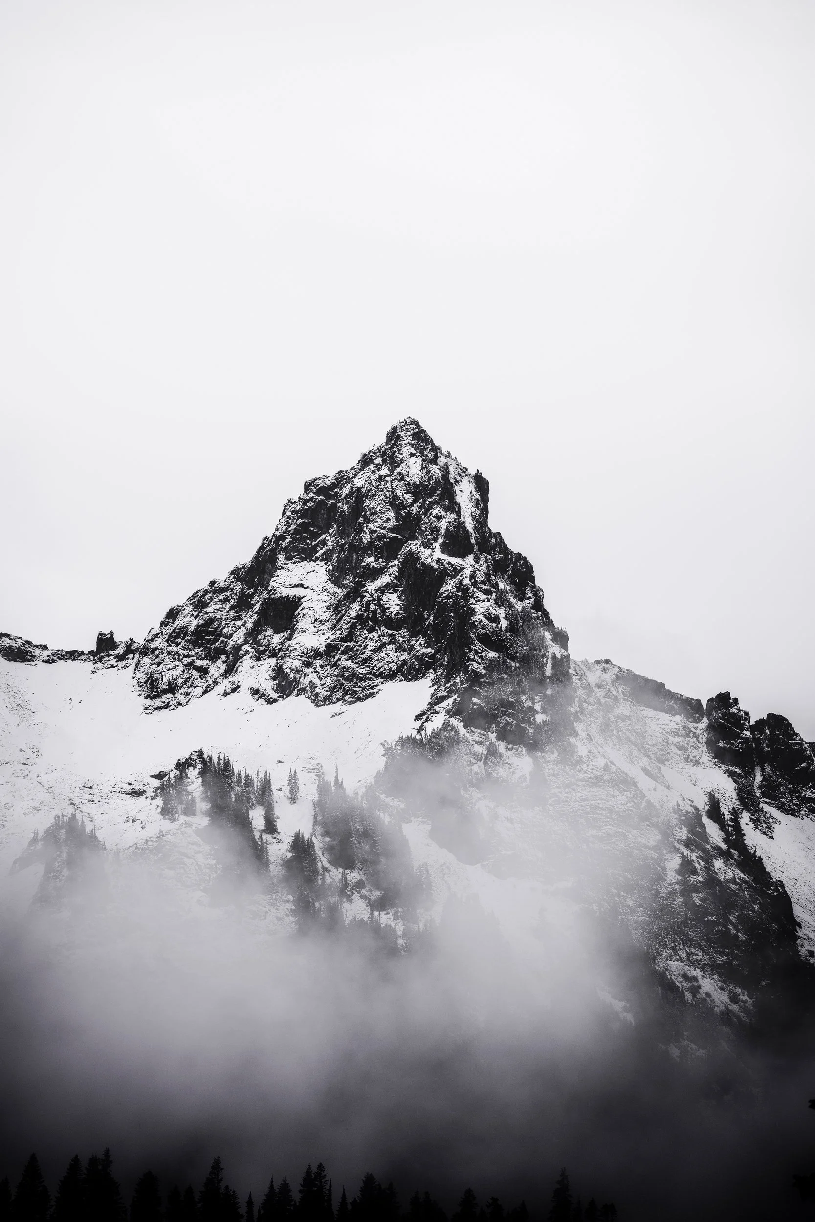 Black and white photograph of the Tatoosh Range fading into mist near Mount Rainier, Washington, by Ryan L. Smith