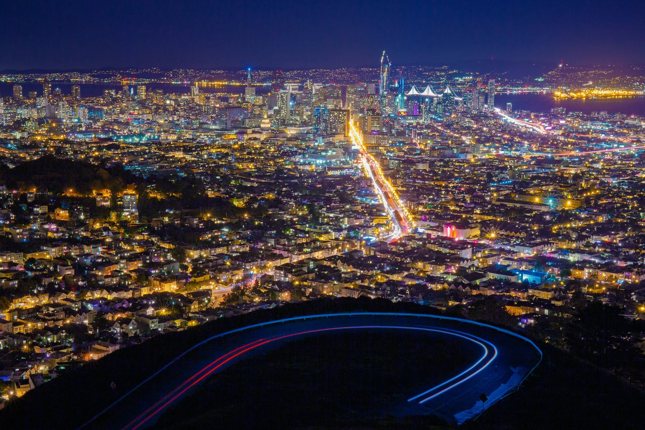 San Francisco skyline lit up at night with light trails, seen from Twin Peaks, California, by Ryan L. Smith