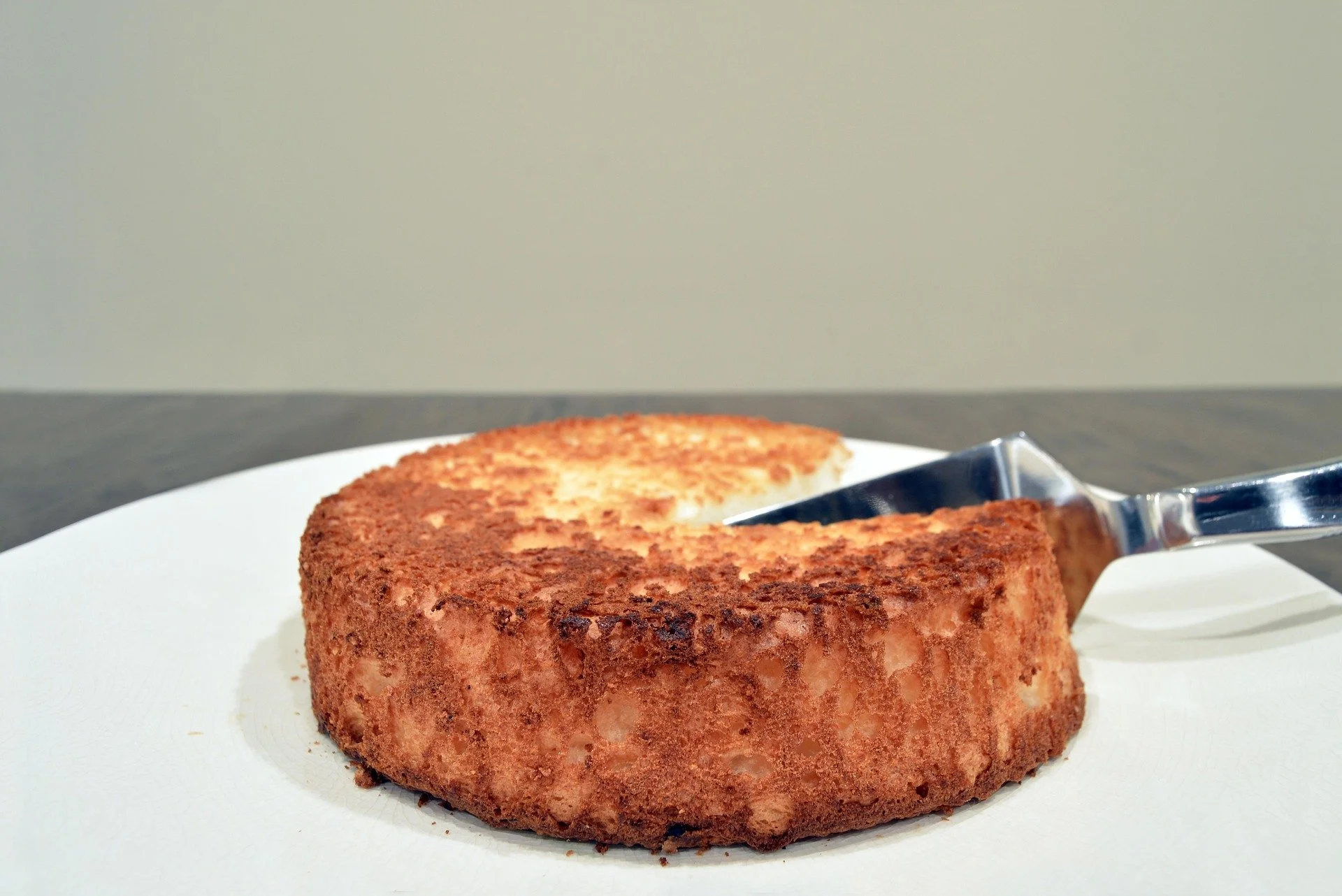 an angel food cake being sliced