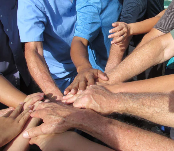 Morning Prayer with hands all in.jpg