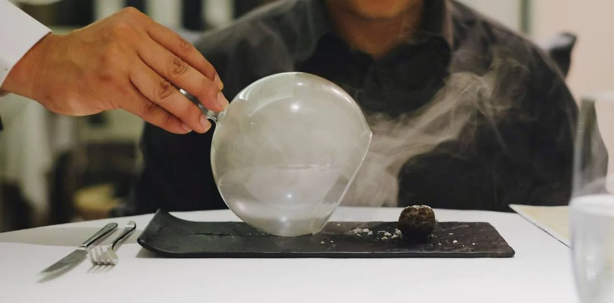 An organic bamboo charcoal-shelled nugget with a spiced and smoked Thai sea bass filling.