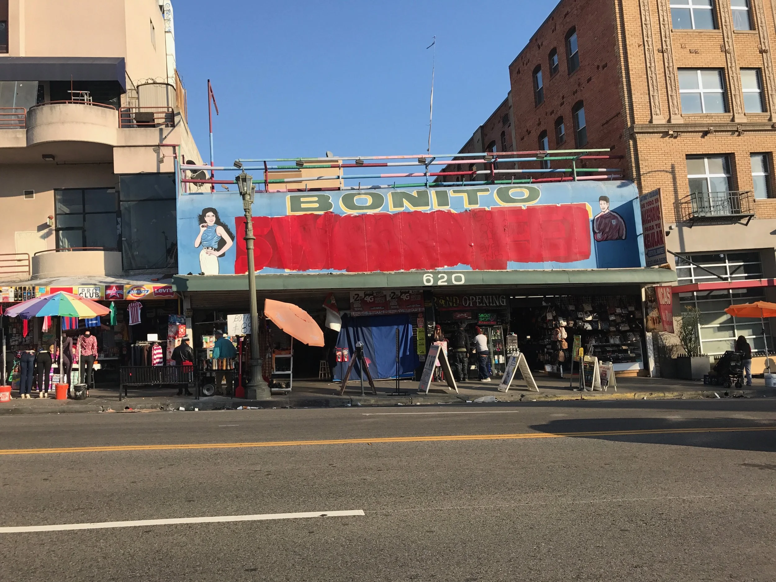 Vandalized "Bonito Swap Meet" mural that YOU ARE HERE. 3 will restore