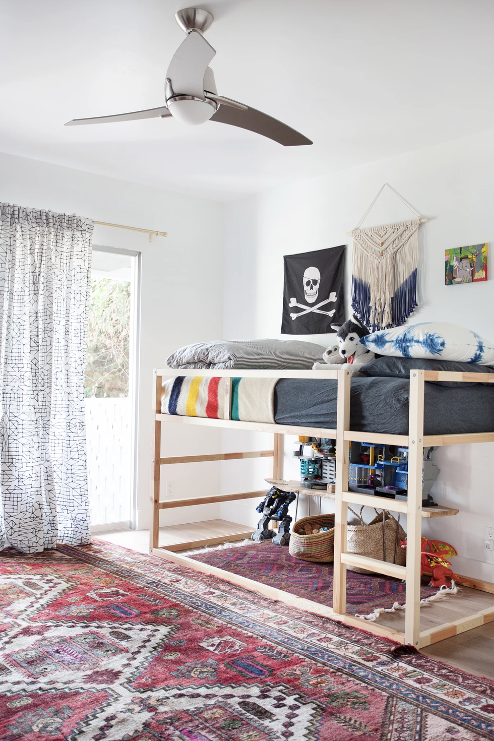 Space under a bunk bed can be utilized for any sort of toy storage! You can either use it as a home for toys, or turn it into a play area where toys are also stored! Via: House Beautiful