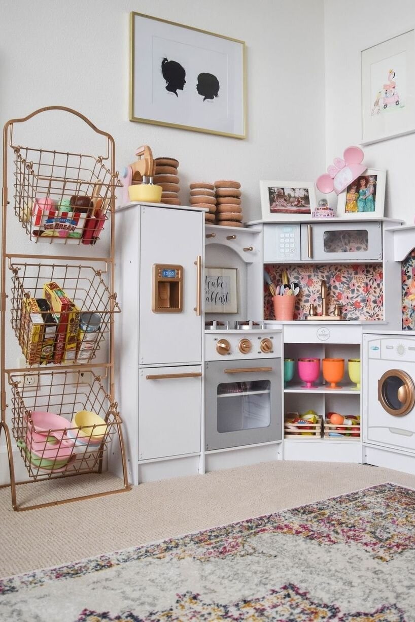 Is there anything better than an organized kitchen? We think not! Incorporating designated toy storage area in the play area is also a great way to encourage easy clean -up once playtime is over. Via: House Beautiful