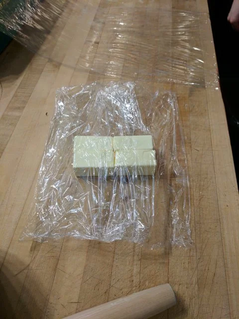 Double wrap the four sticks of butter to prepare a slight punding and rolling technique.