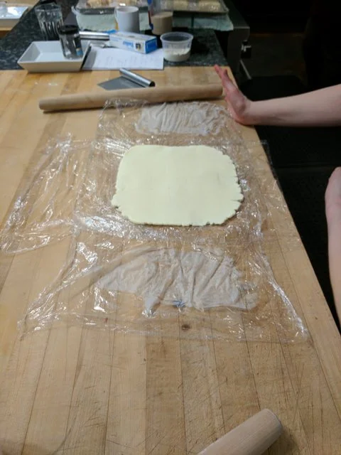 Trim rough edges of the butter block to form a perfect square.