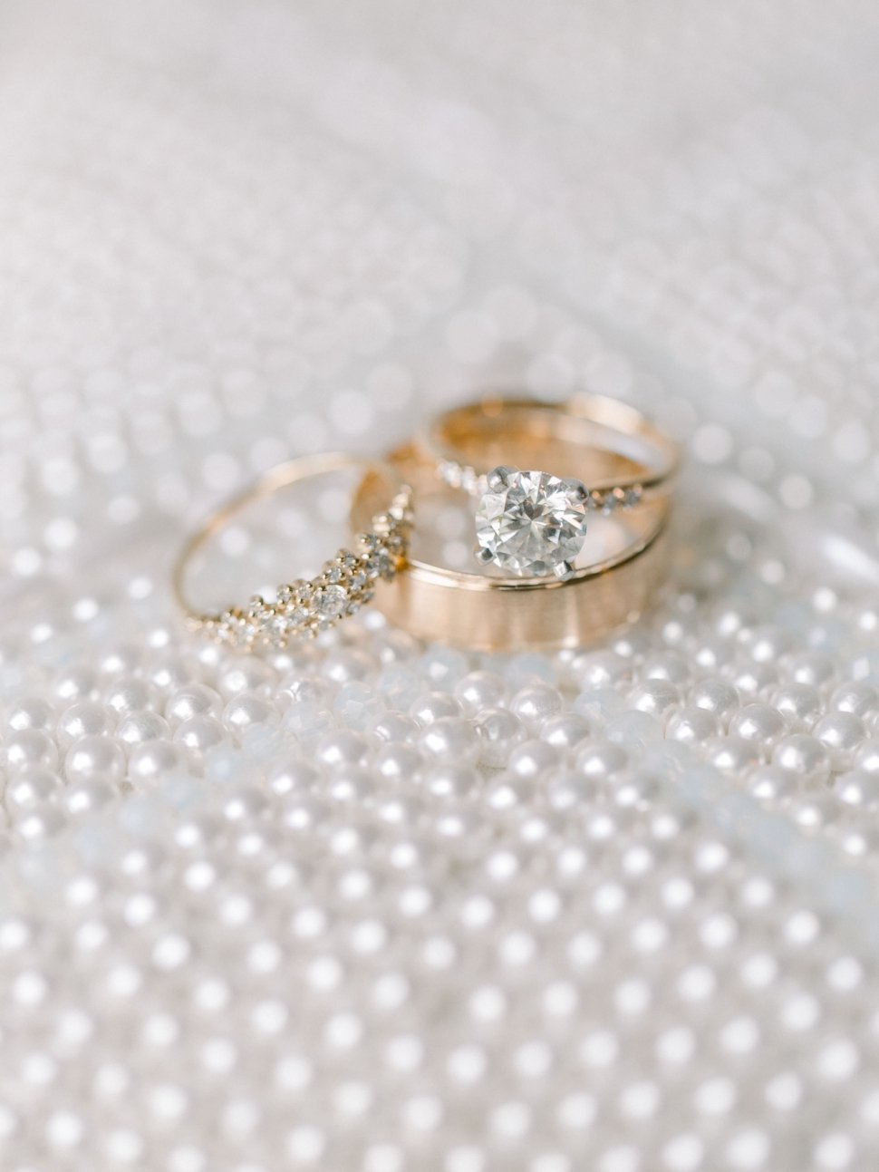 wedding ring on pearl clutch