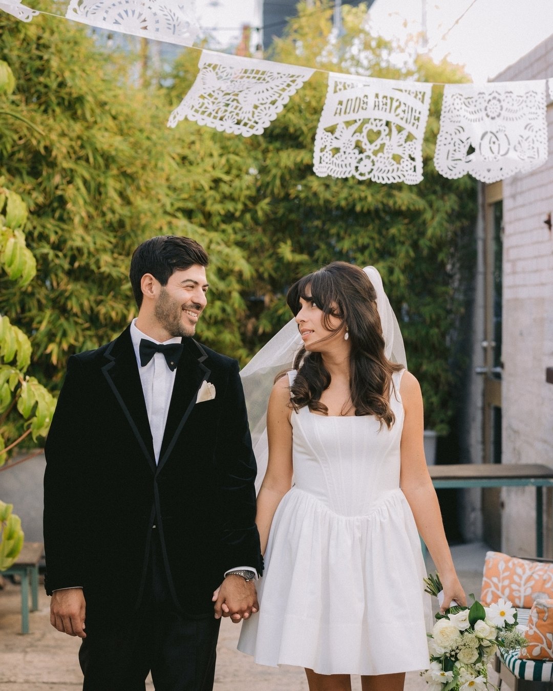 Continuing with the culture theme, M+R wanted to showcase their hispanic roots in a variety of ways on their special day. One of which was hanging this Papel Picado (or Mexican folk art) in the back outdoor area of their venue - which I absolutely lo