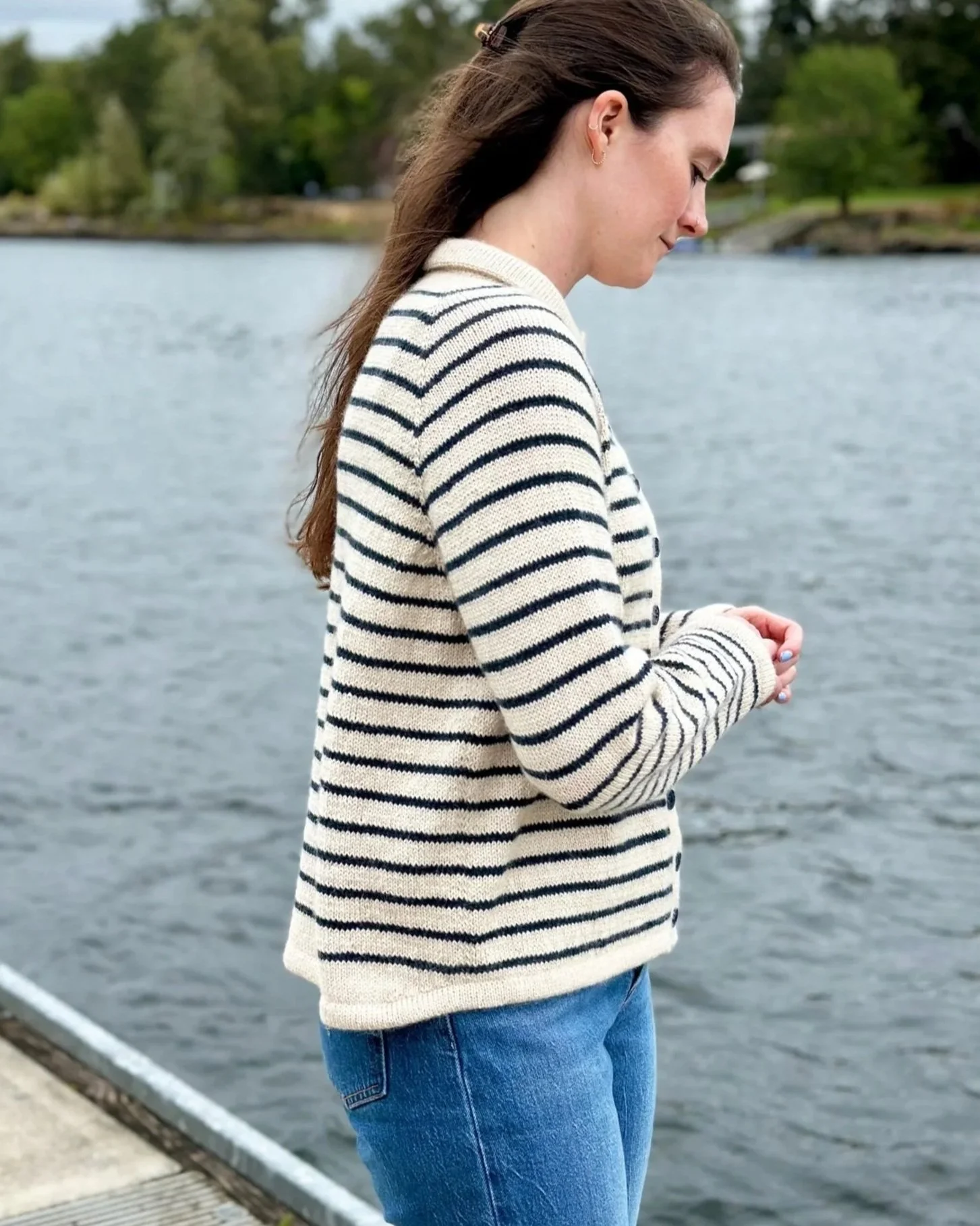 Side view of King Tides cardigan knitting pattern that shows the angled hemline.