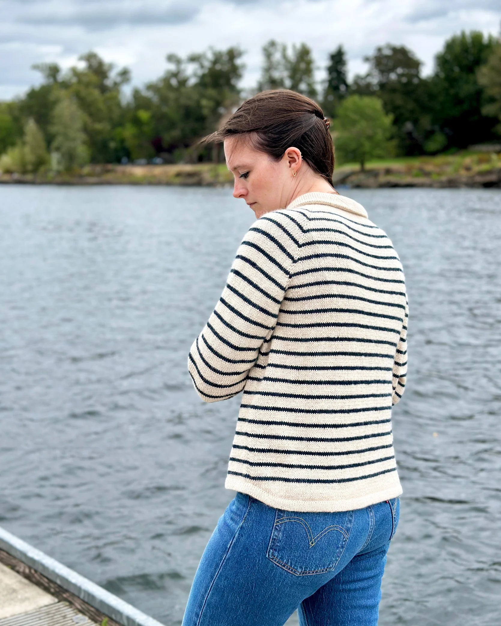 Back view of King Tides cardigan knitting pattern that shows the angled hemline.