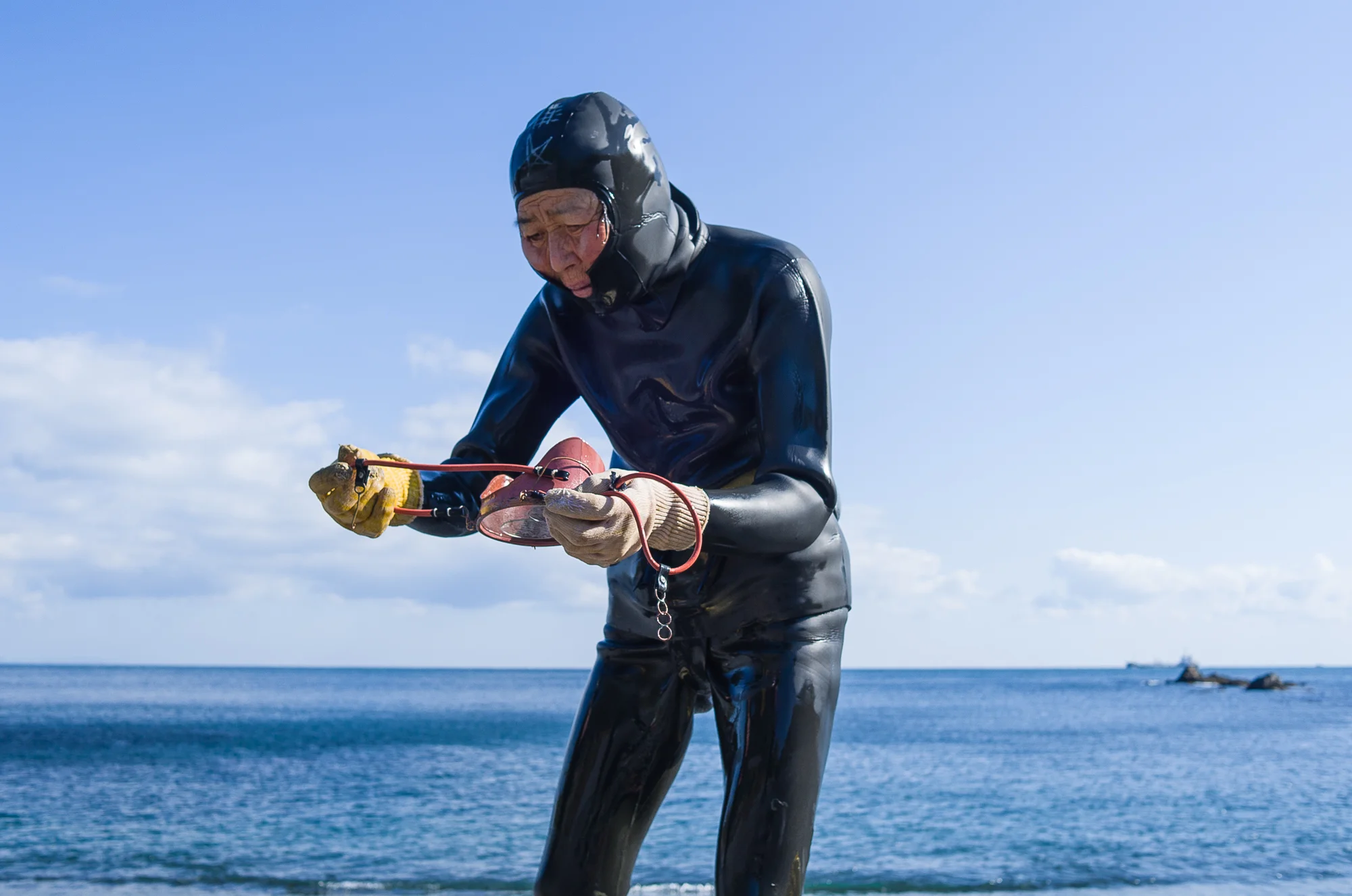  Etched into the hood of diver’s wetsuits are the "Seiman" and "Doman" symbols thought to ward off danger.  