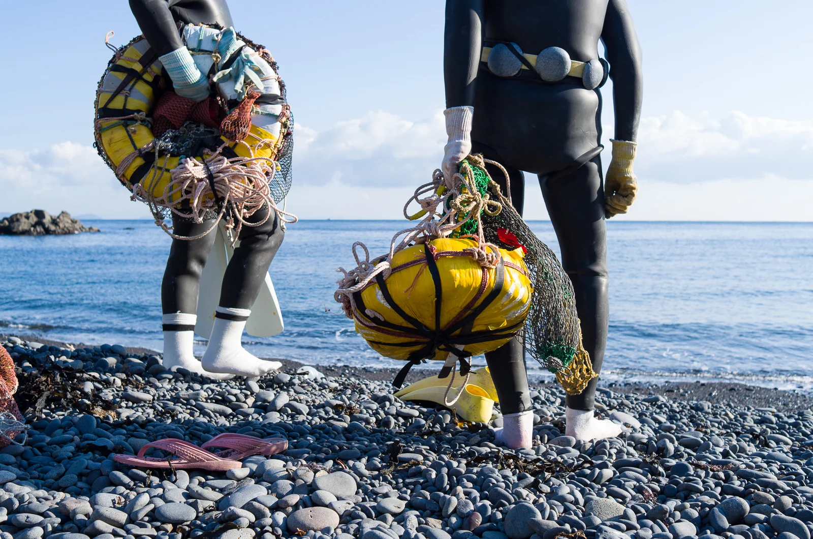  The tools of the diving trade are few and simple. A weight belt, float, and net. Fins and wet suits were added only in the 1960s.  