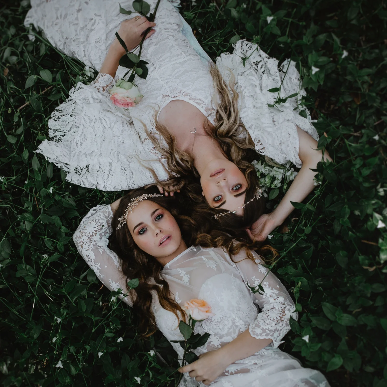 romantic-boho-brides-holding-hands-close-up.jpg