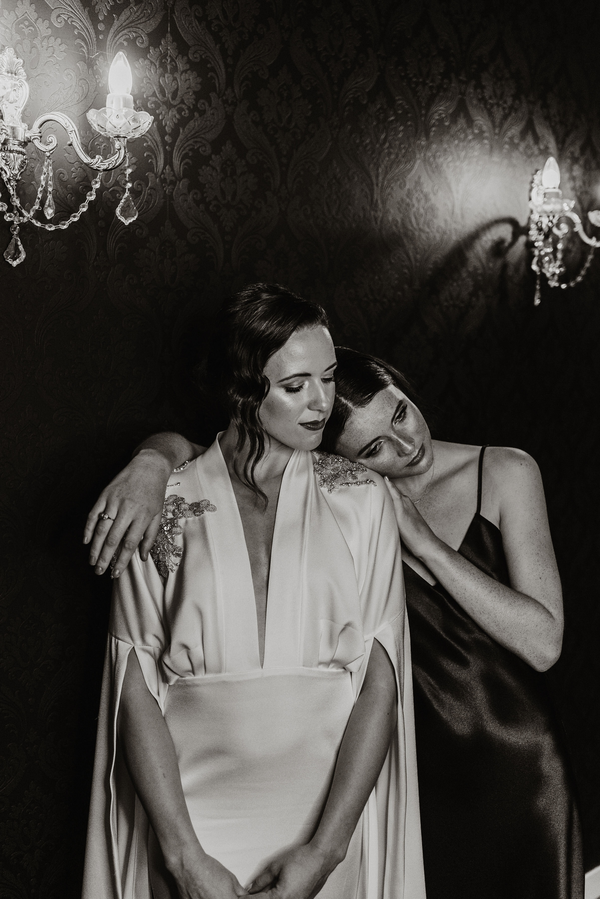 bridesmaid-with-bride-with-silk-wedding-dress.jpg