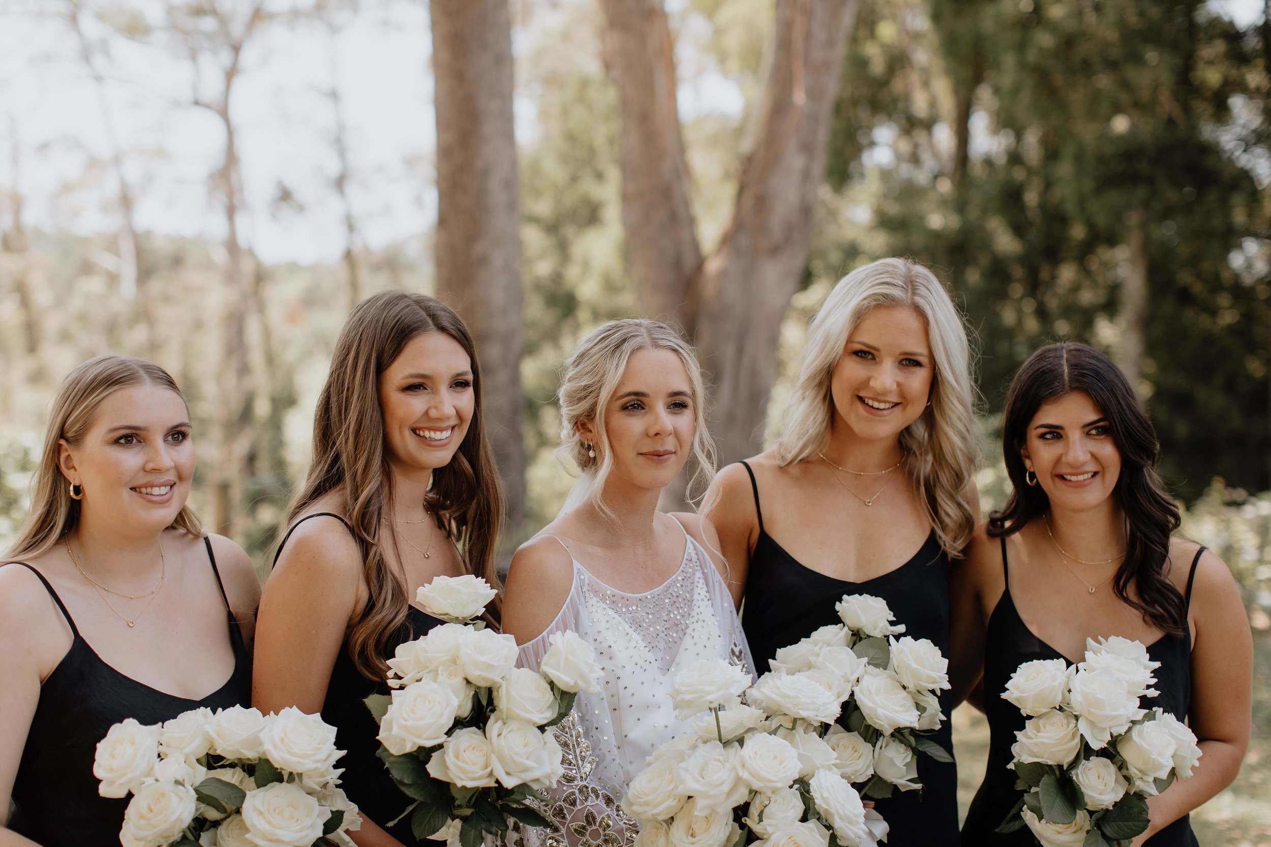 black-walnut-wedding-bridal-party-white-roses.jpg